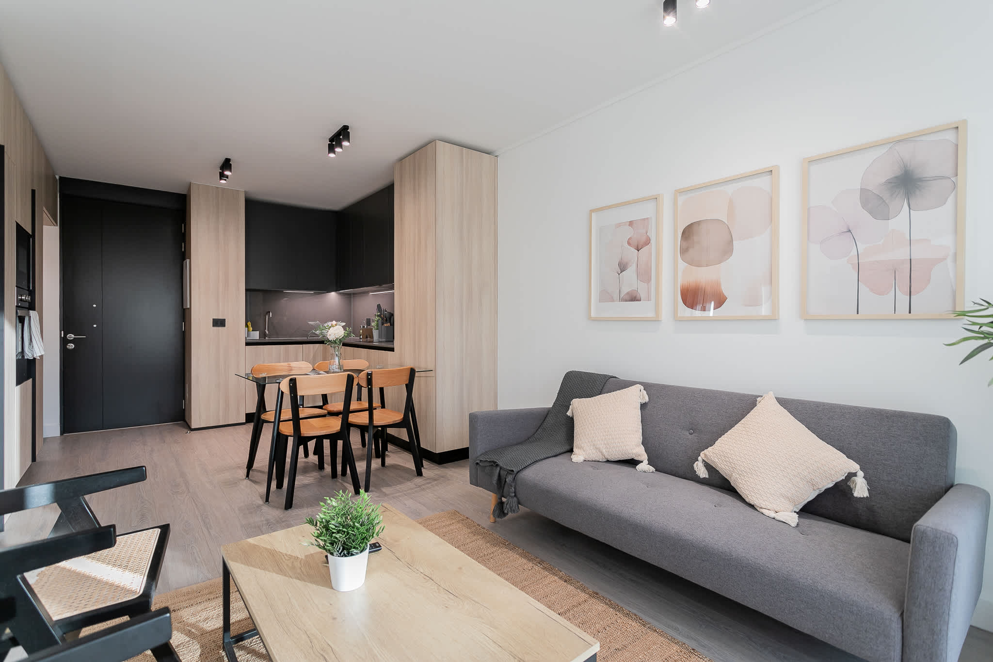 Experience modern comfort in this stylish studio with a cozy living area and sleek kitchen, perfect for a relaxing stay.