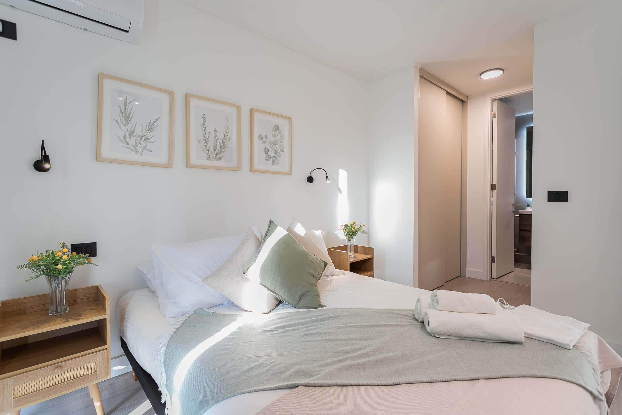 Relax in this cozy and bright bedroom, complete with modern decor and a comfortable bed for a restful stay.