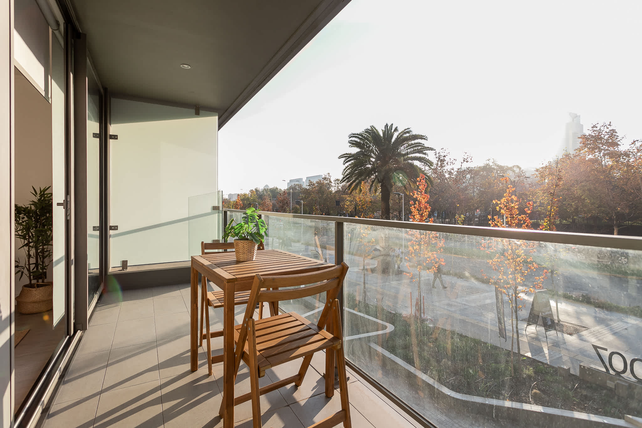 Relax on your private balcony with stunning views of lush greenery and the cityscape, perfect for morning coffee or evening relaxation.