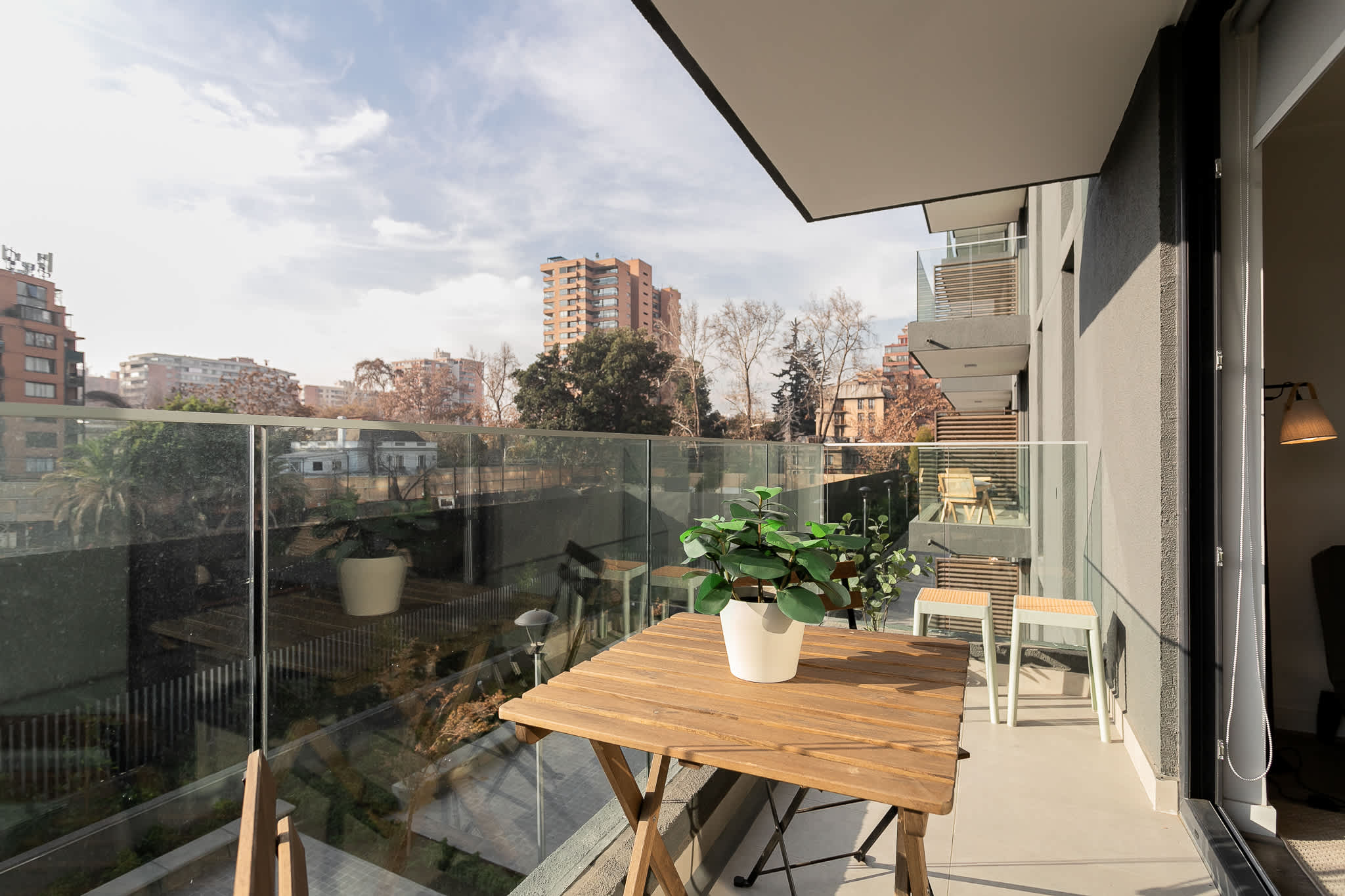 Relax on your private balcony with stunning city views and lush greenery, perfect for morning coffee or evening relaxation.