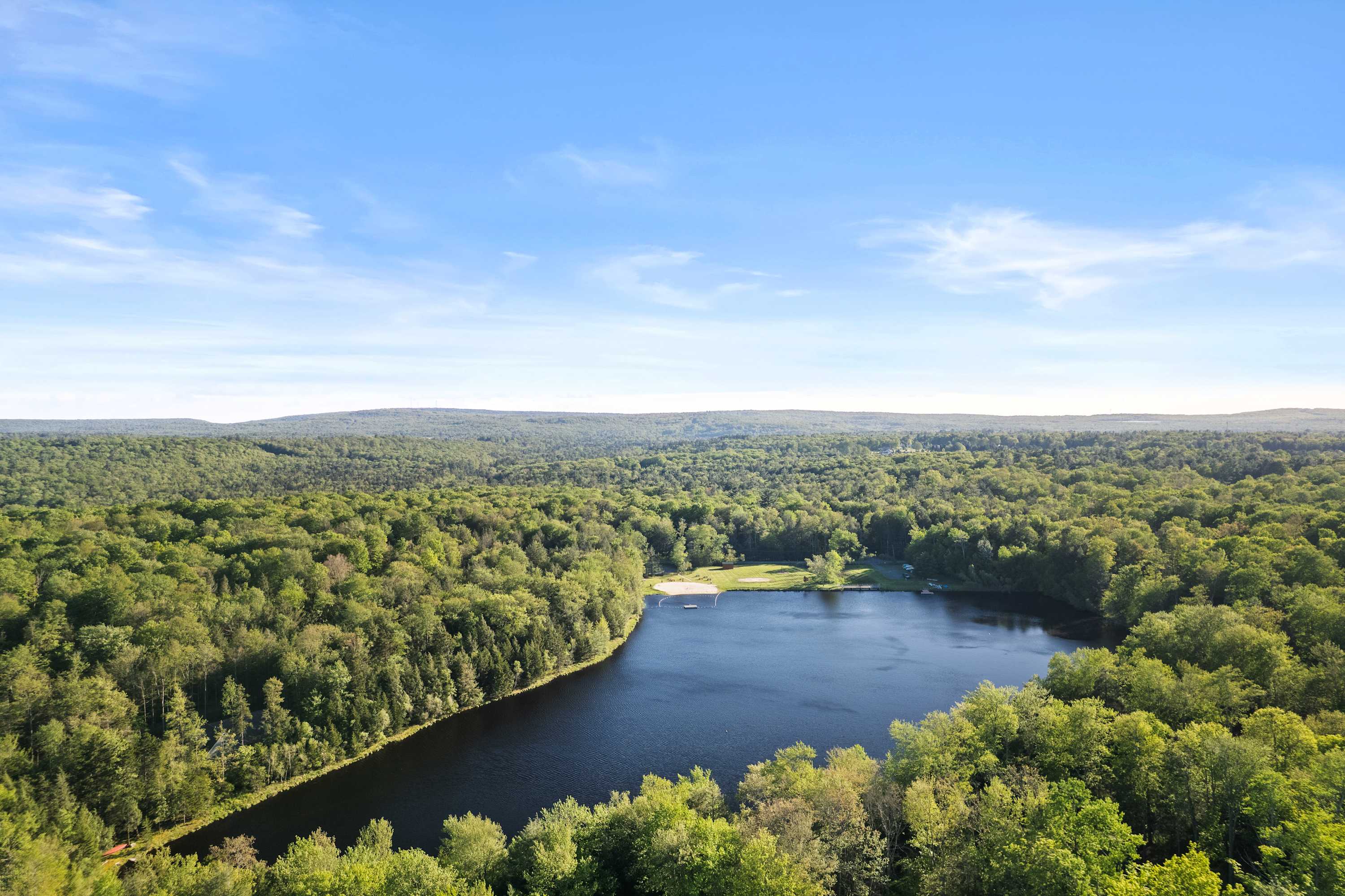 Enjoy the tranquil beauty of Lake Guenevere, where calm waters and lush surroundings create the perfect escape.