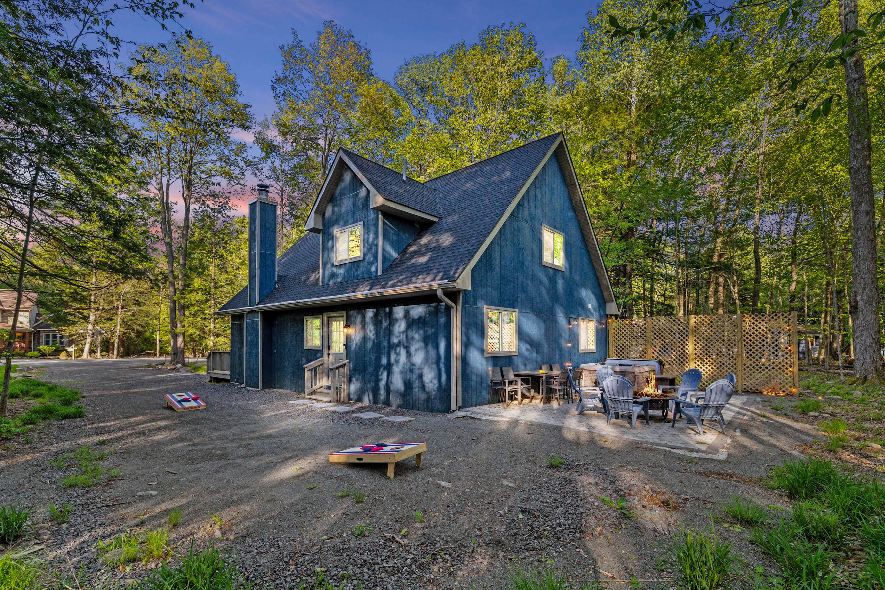 Relax and unwind with a fire pit and hot tub, right in your backyard—a perfect spot for a peaceful evening.