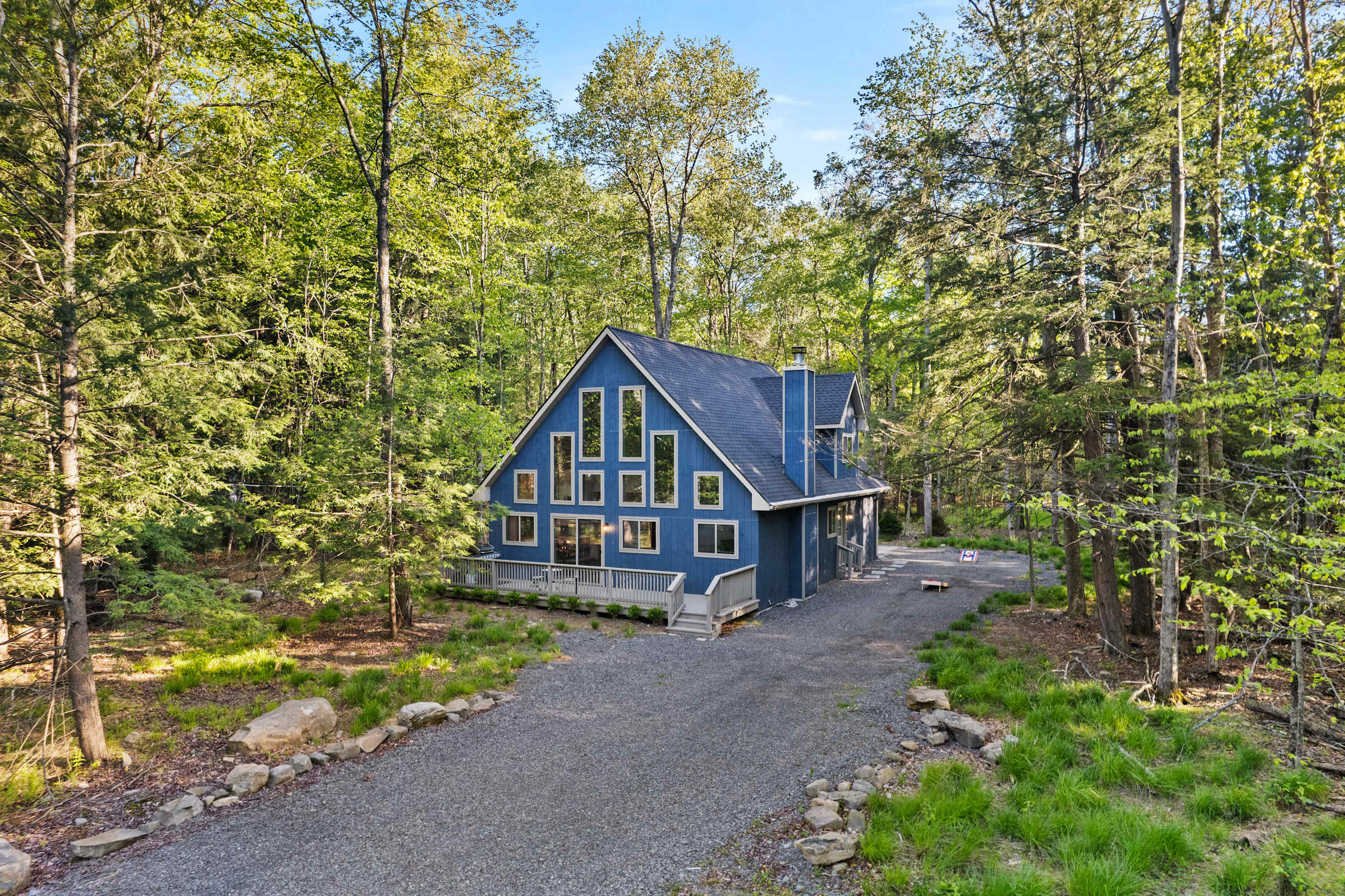 The beautiful exterior features a spacious driveway, offering parking for up to 6 vehicles.