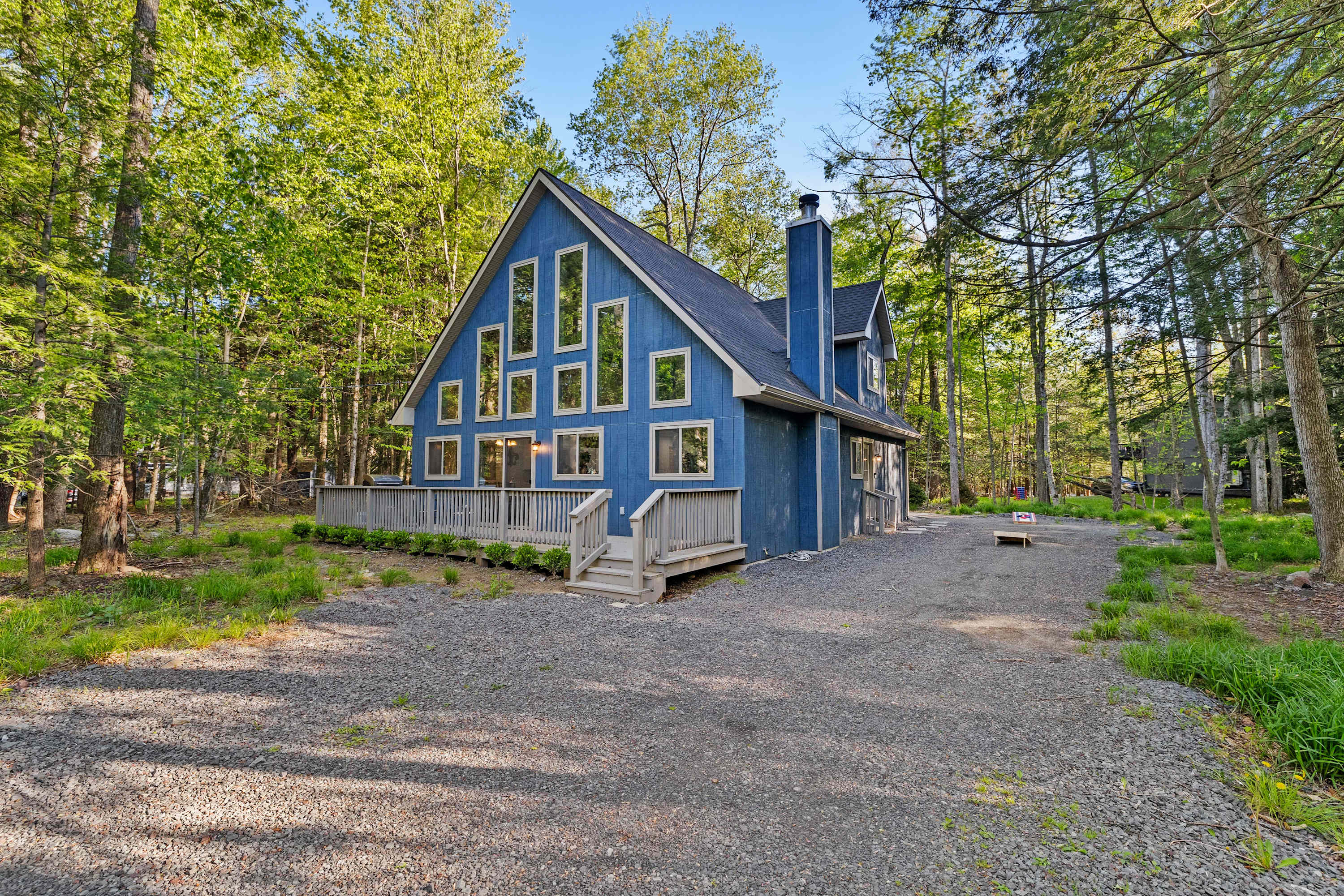 Step into this charming blue cabin, surrounded by a serene forest, and enjoy the warmth of the morning sun. Your peaceful getaway awaits. 🌲✨ #TranquilEscape