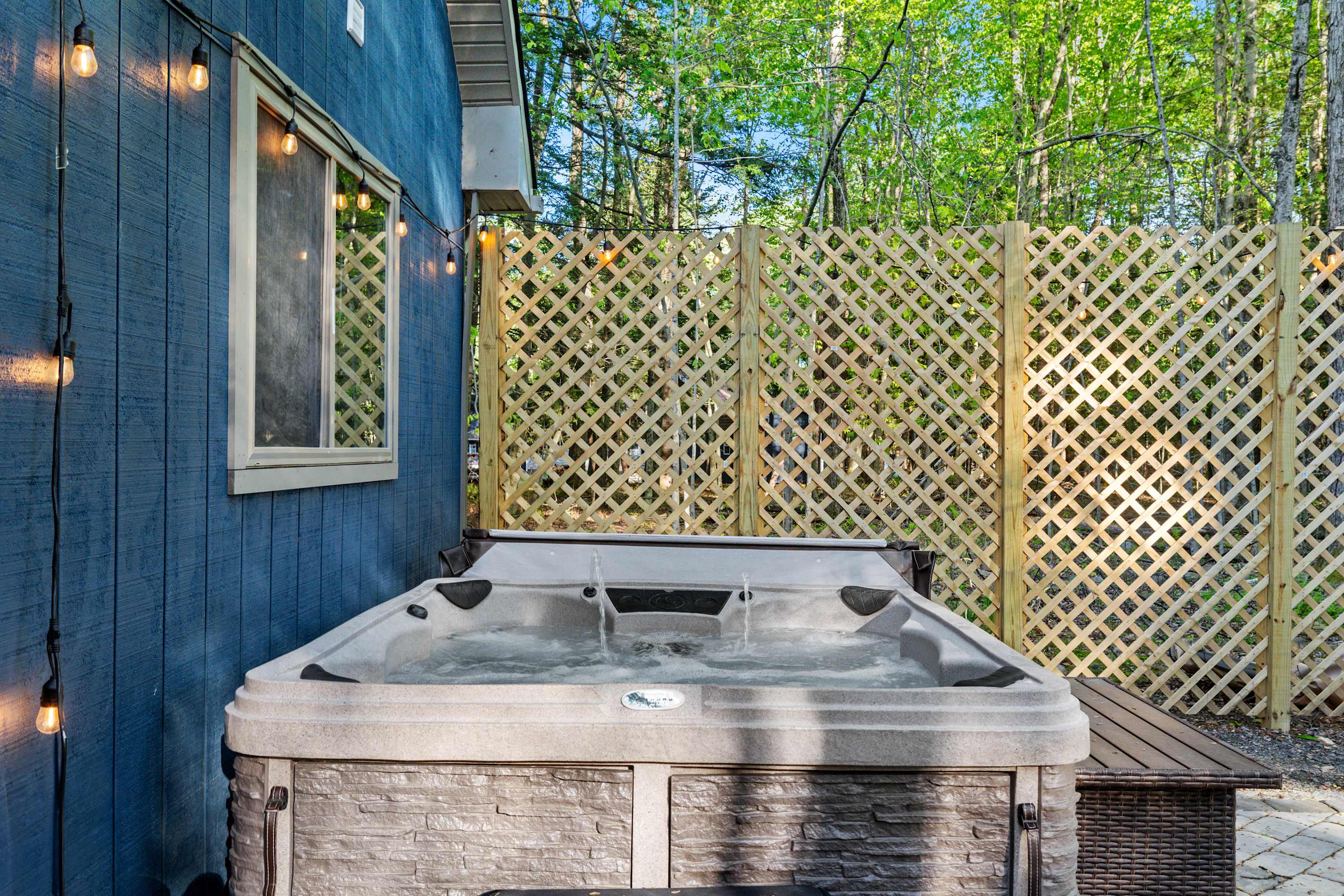 Relax in the hot tub, a perfect spot to enjoy the peaceful surroundings and melt away your stress.