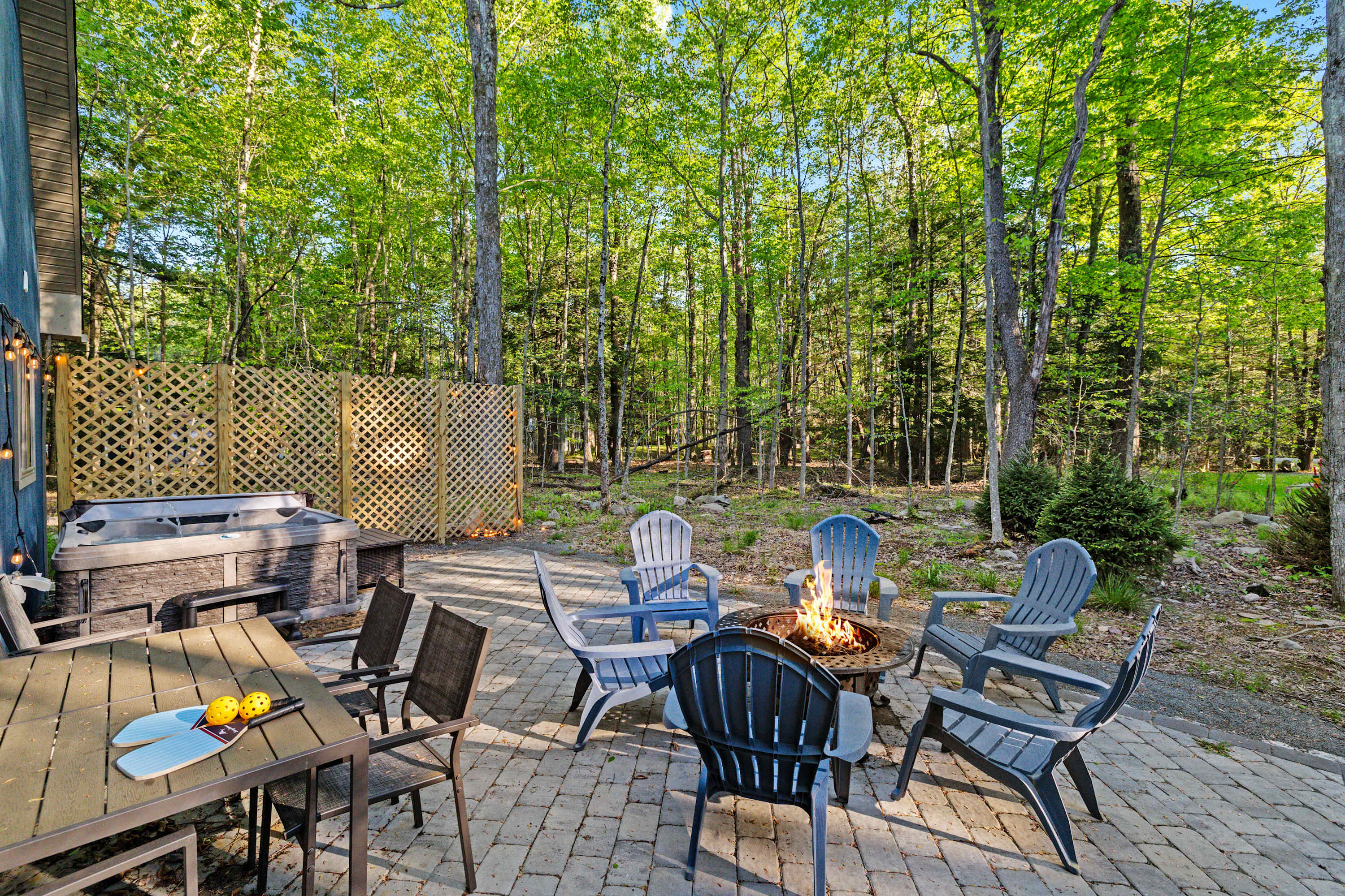 Enjoy the best of outdoor living with a hot tub, fire pit, and dining area—ideal for relaxing evenings and memorable gatherings!