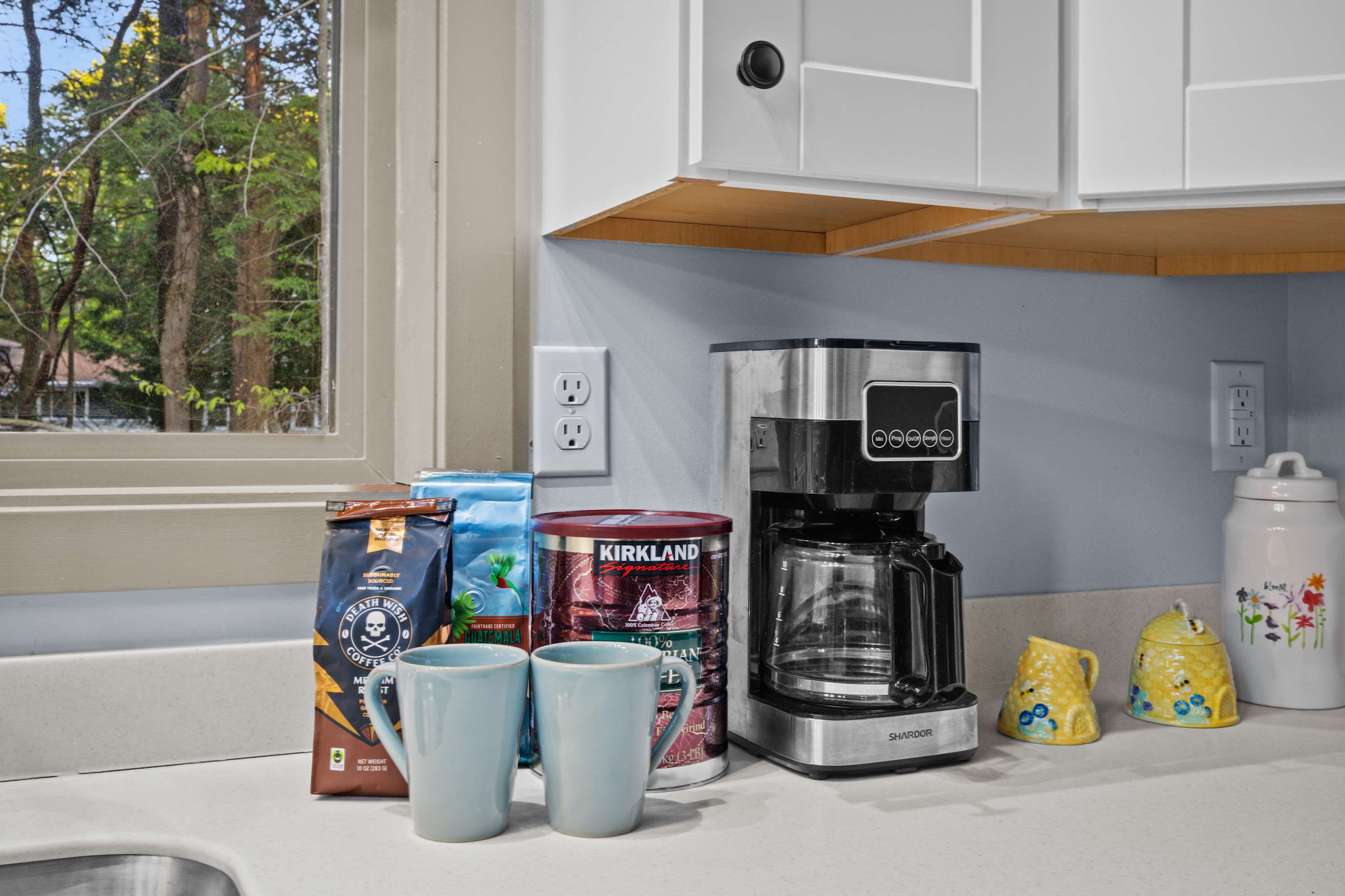 Kickstart your day with ease! A coffee pot and coffee grounds are provided for your convenience.