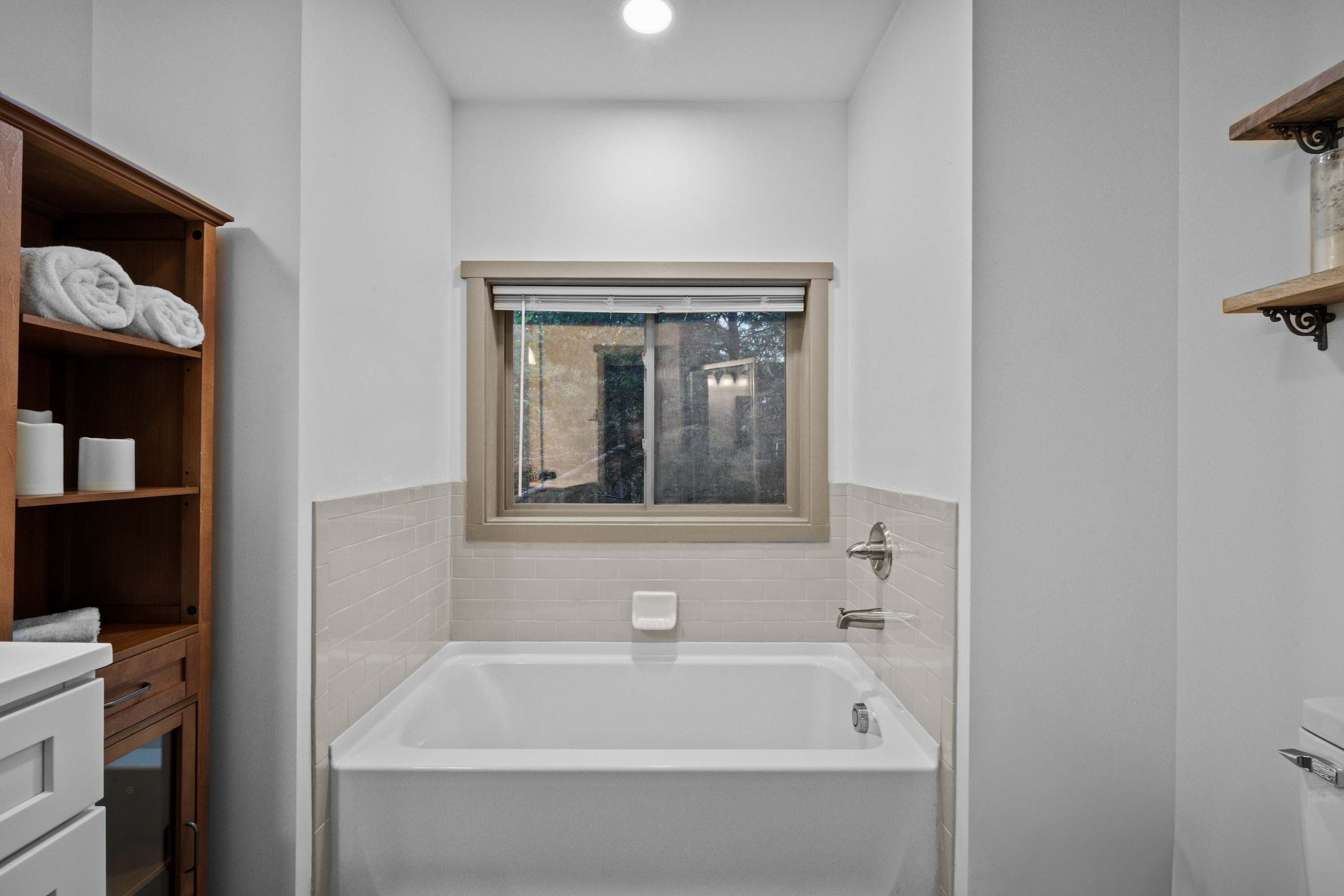 Master bathroom: Large soaking tub with a nature view