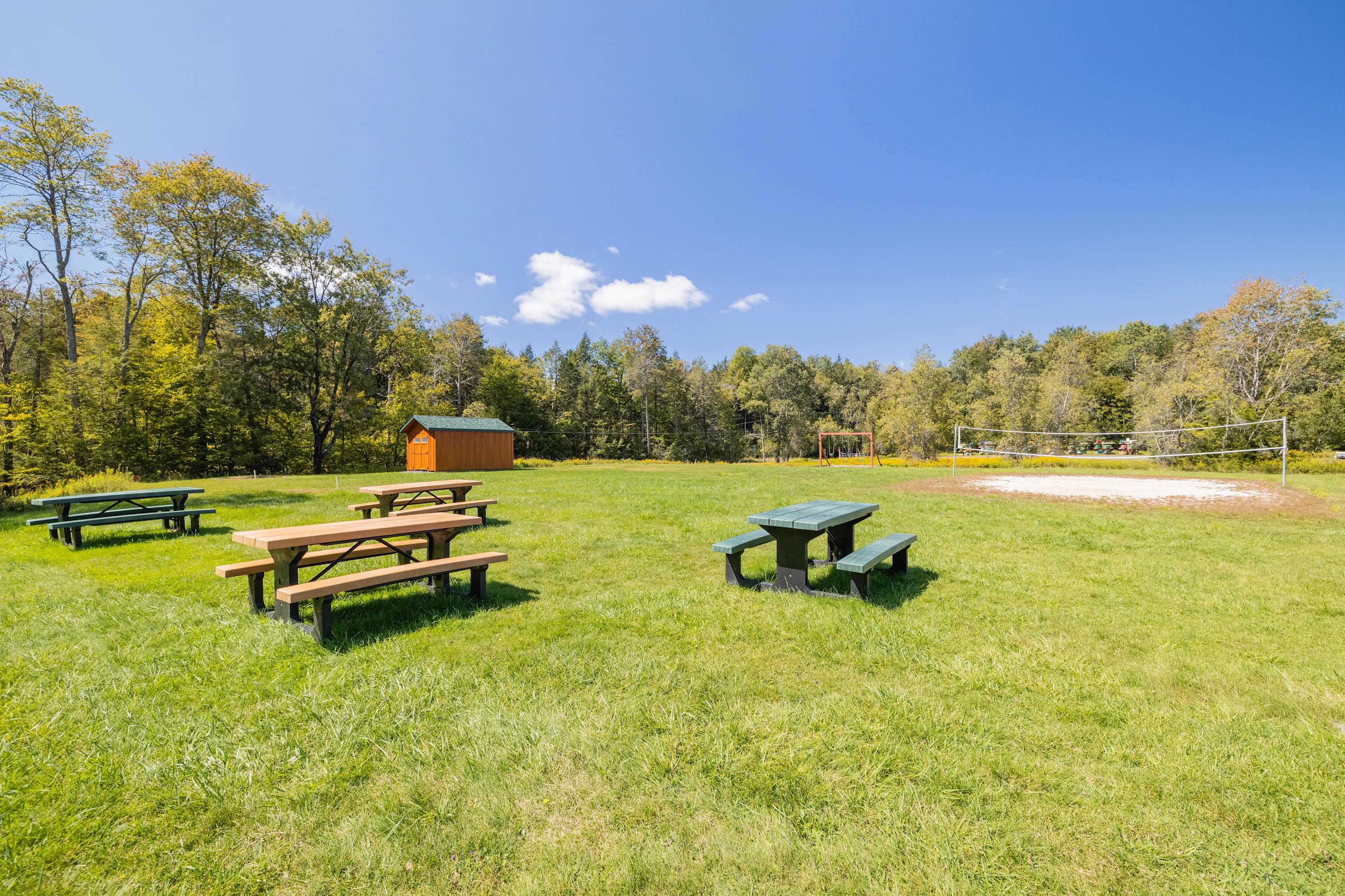 Picnic tables and a sand volleyball court are available by the beach