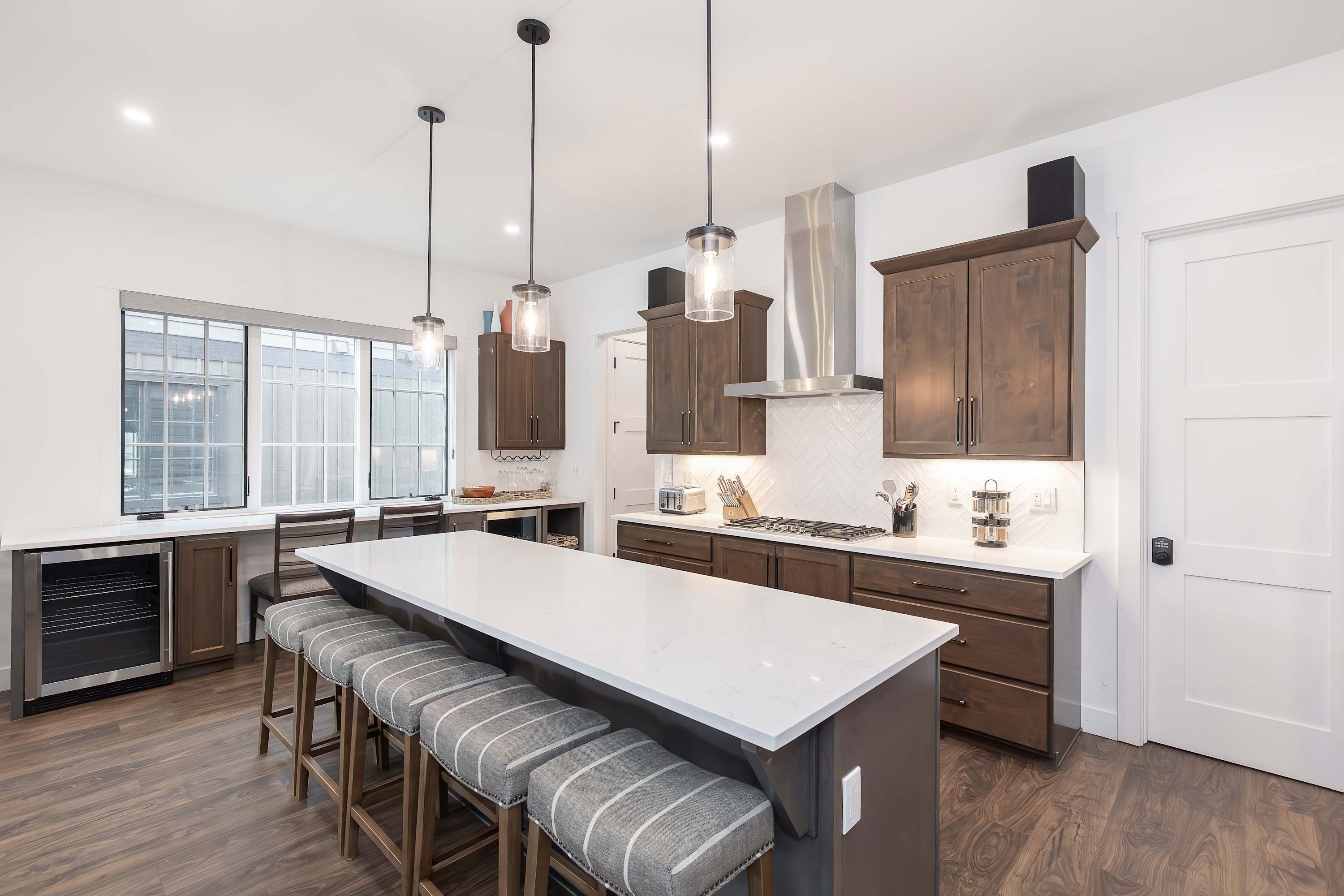 - Bright and spacious kitchen with a large island, bar seating, and modern finishes. Perfect for preparing meals, entertaining, or gathering with family and friends.
