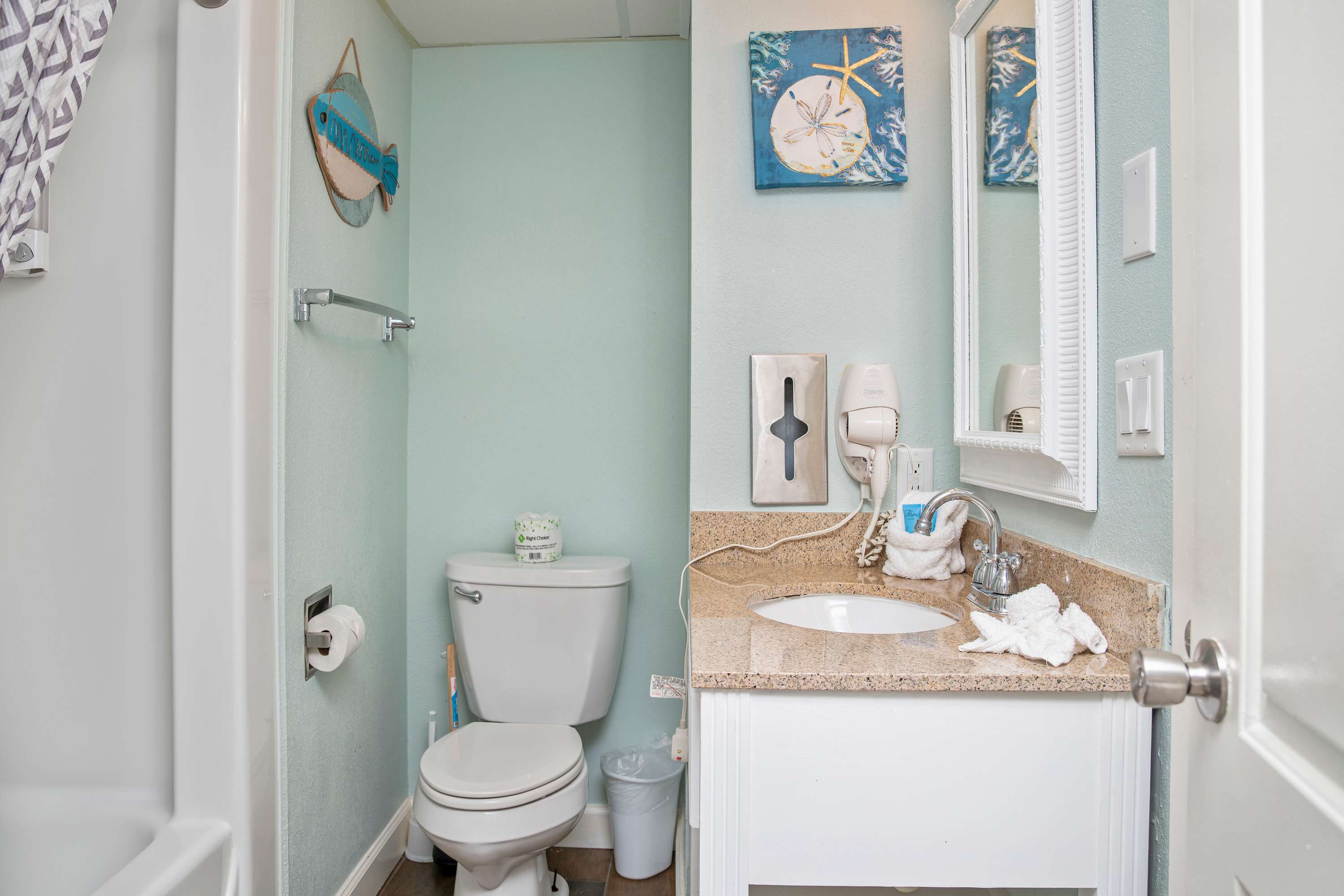 Comfort meets style in this clean, functional bathroom retreat.