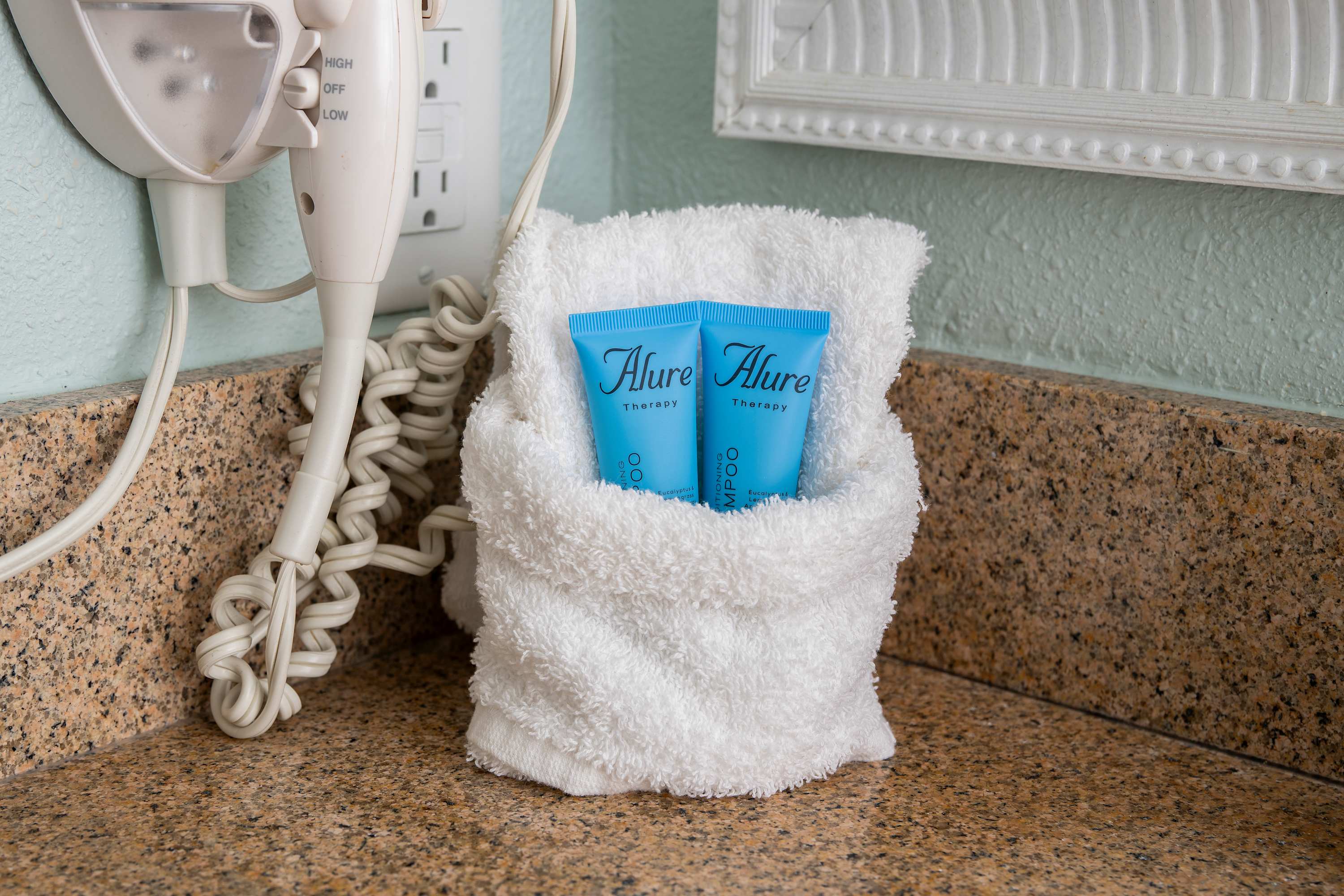 Start your beach day with a bright vanity and fluffy, hotel-style towels.