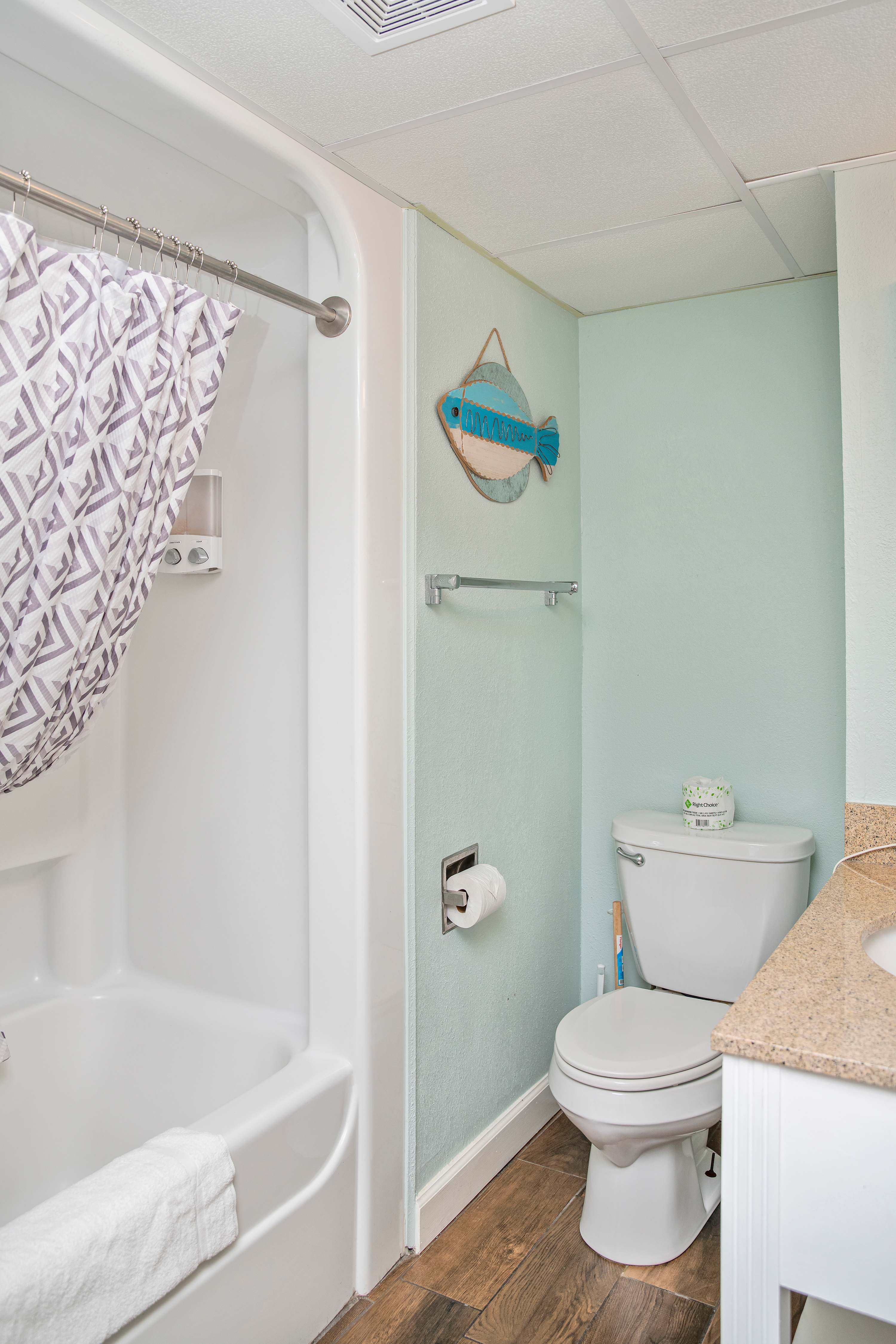 
Recharge in this bright, beach-inspired bathroom with all the comforts of home