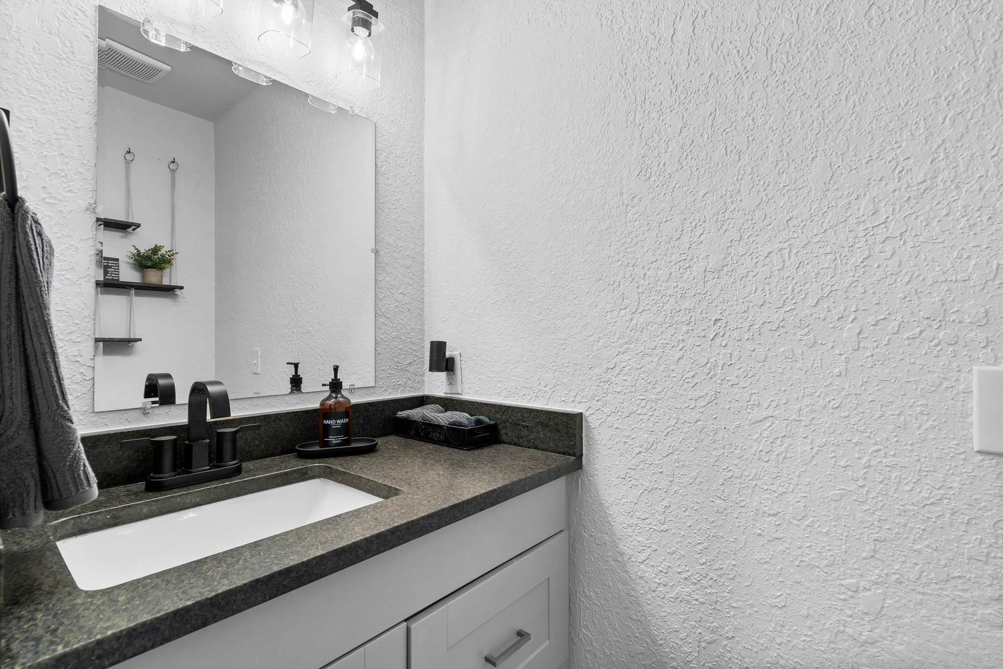 Vanity and toilet room on primary suite