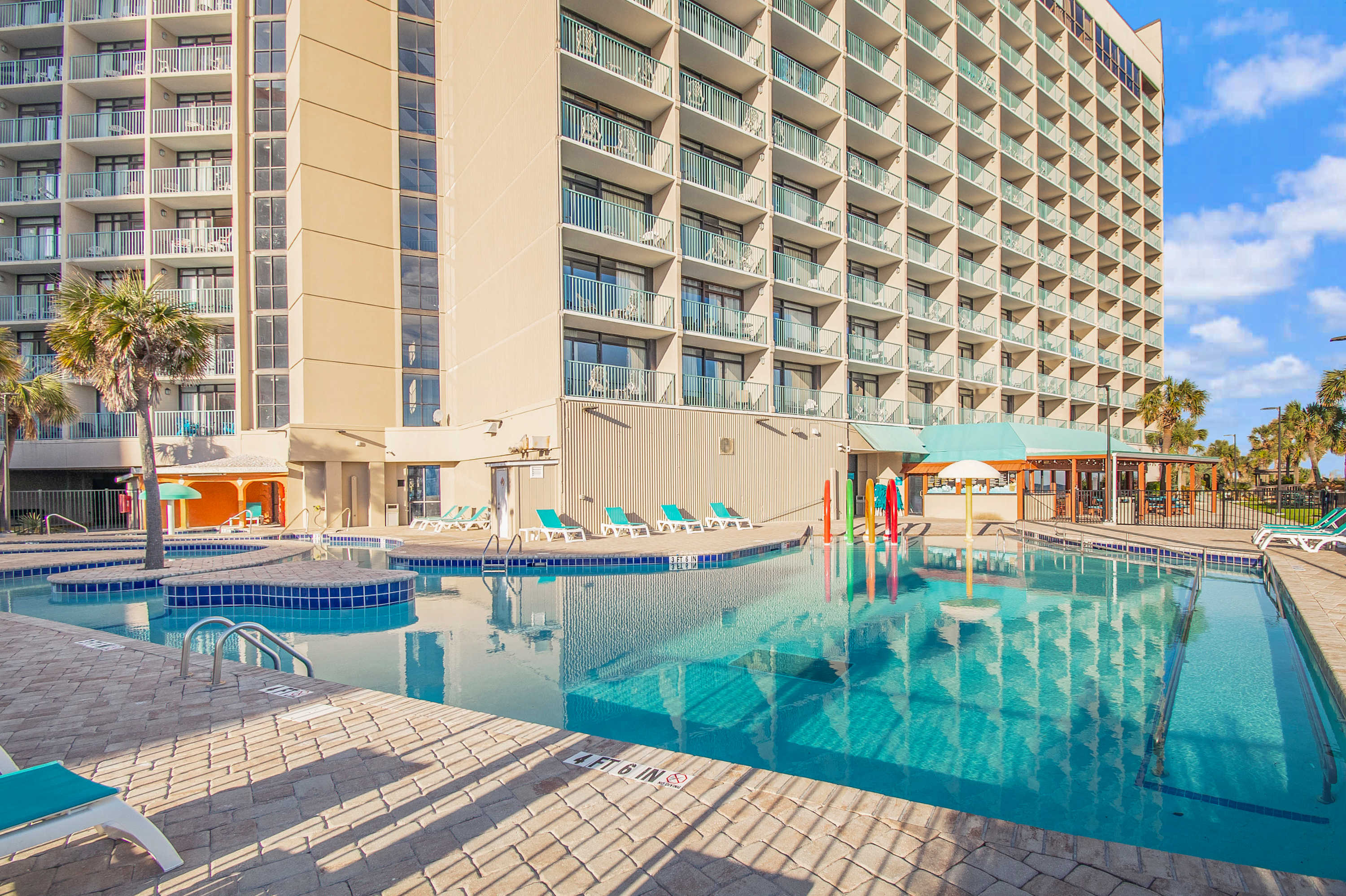 Dive into vacation mode in the sparkling outdoor pool—just steps from your door.
