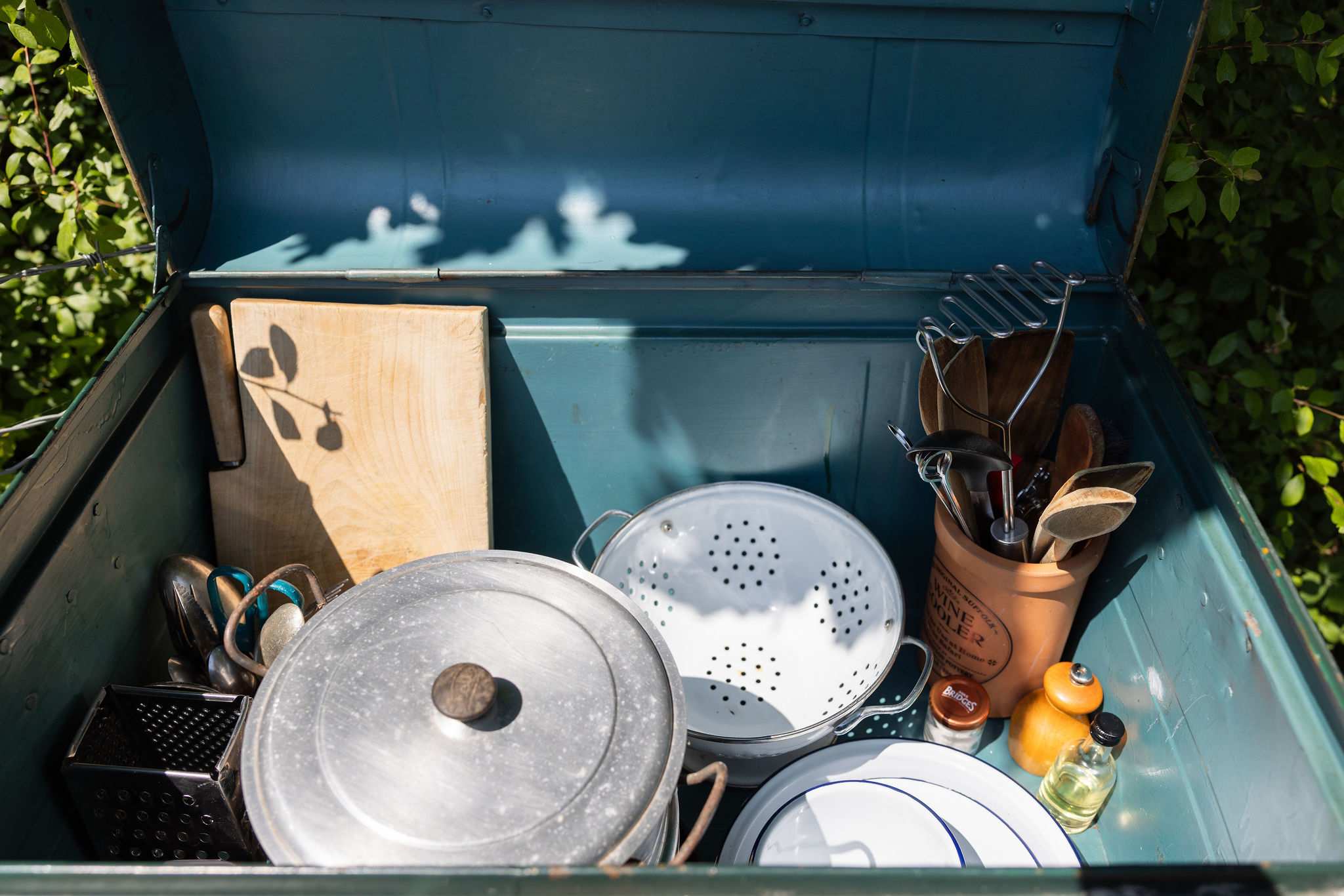 A varied selection of outdoor cooking supplies is provided