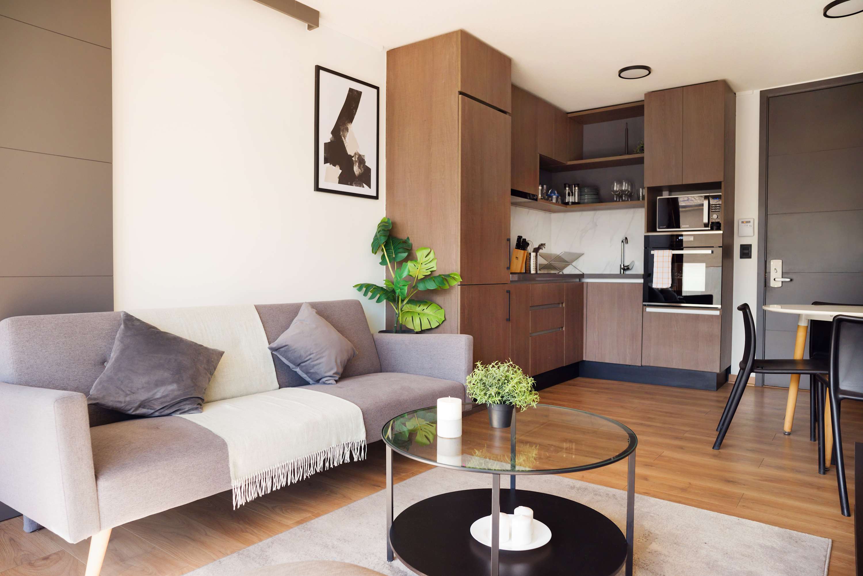 Chic and cozy living space with a modern kitchen, perfect for relaxing after a day of exploring.