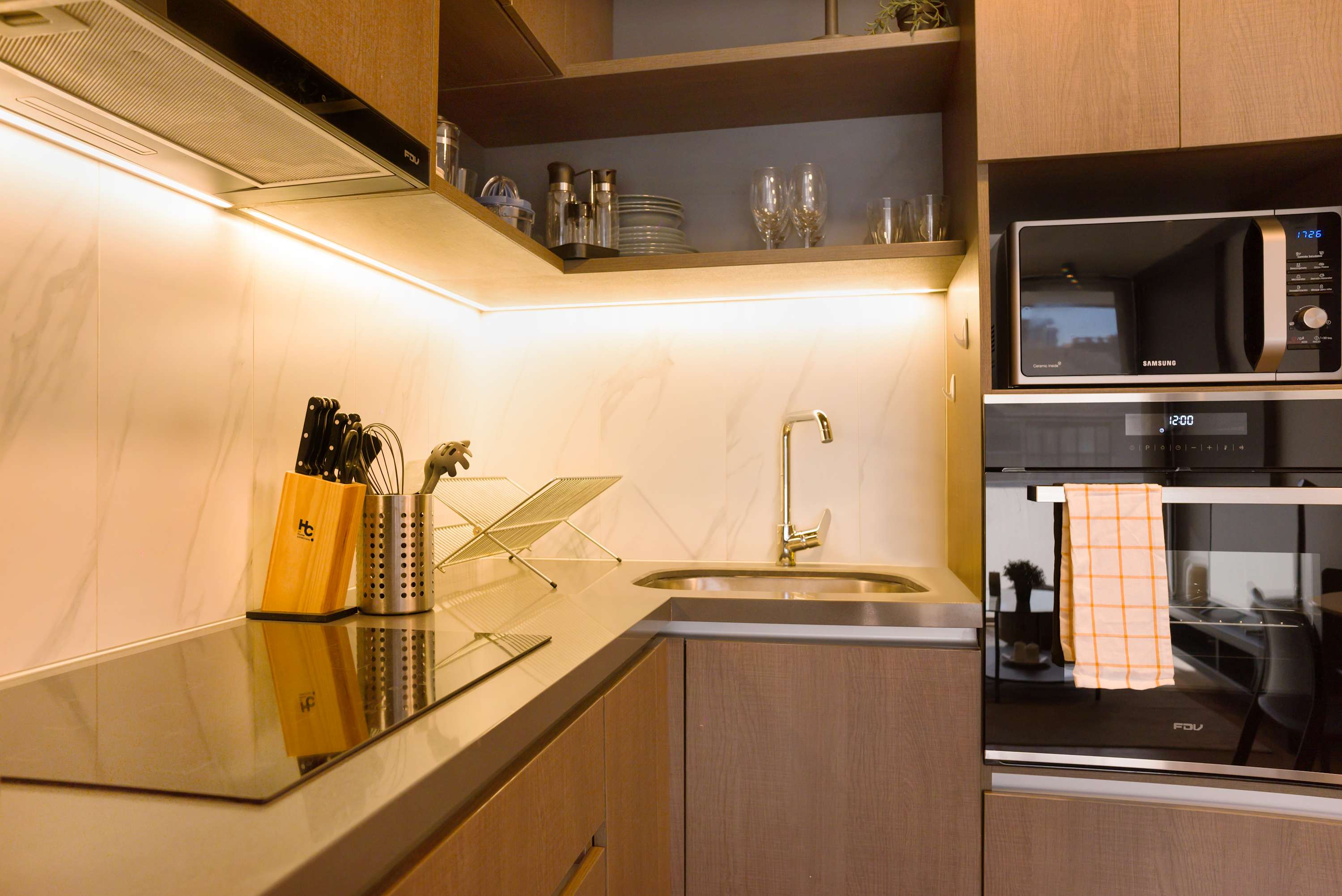 Sleek and modern kitchen with top-notch appliances, perfect for culinary adventures during your stay.
