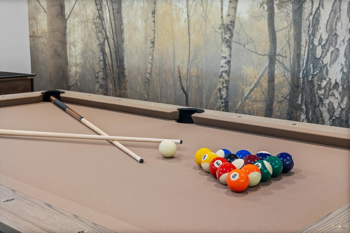Rack them up for a game of pool in the game room.