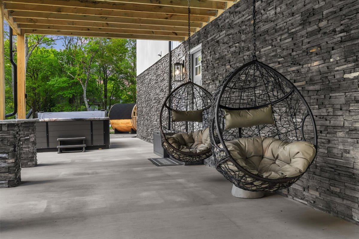 Swing in the hanging egg chairs near the hot tub and sauna.