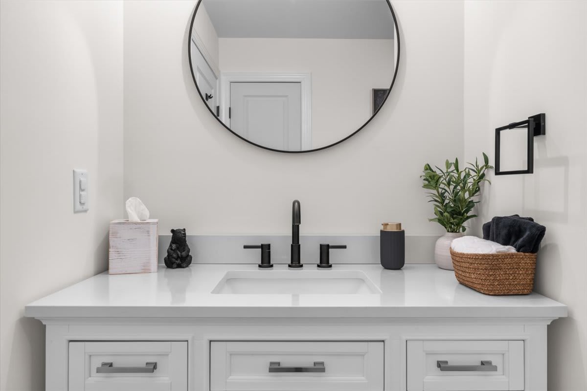 Thoughtful touches like fresh flowers make the bathroom feel like a retreat.