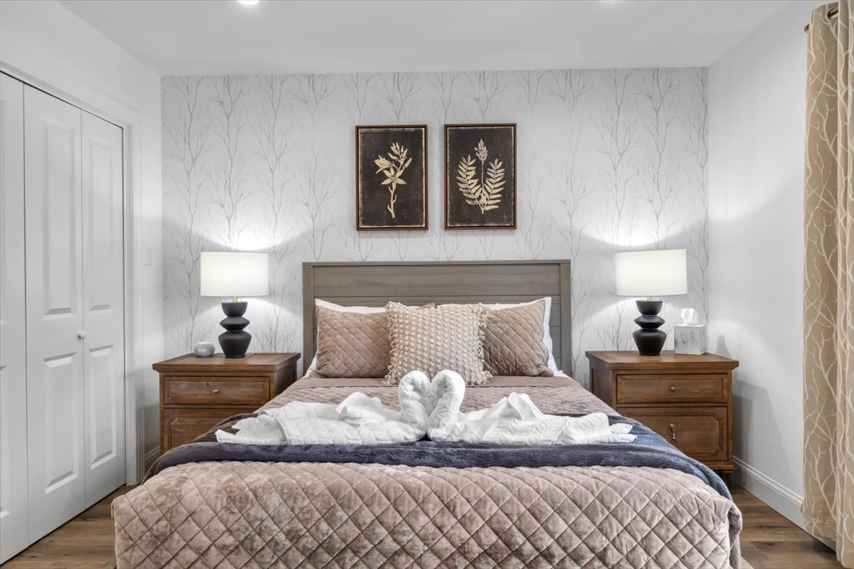 Drift off under cozy linens in this peaceful bedroom with natural touches.