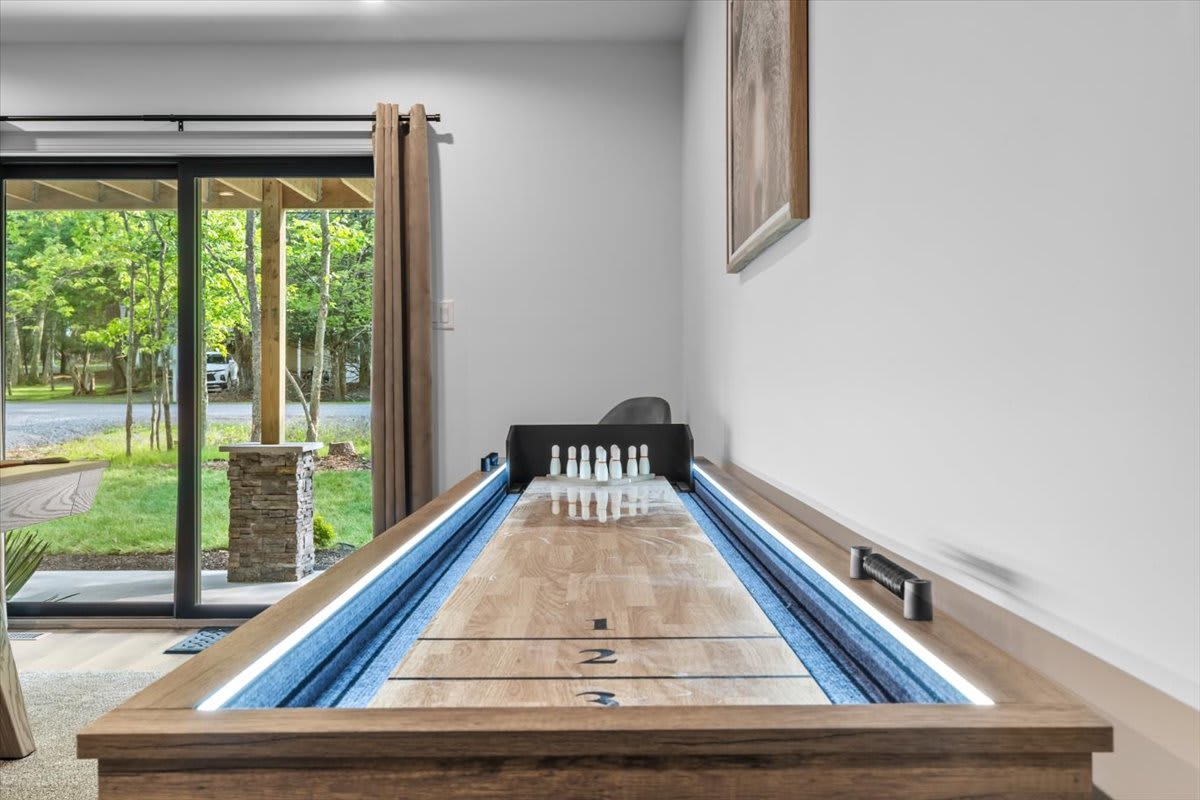 Challenge your friends to shuffleboard in the fun-filled game room.