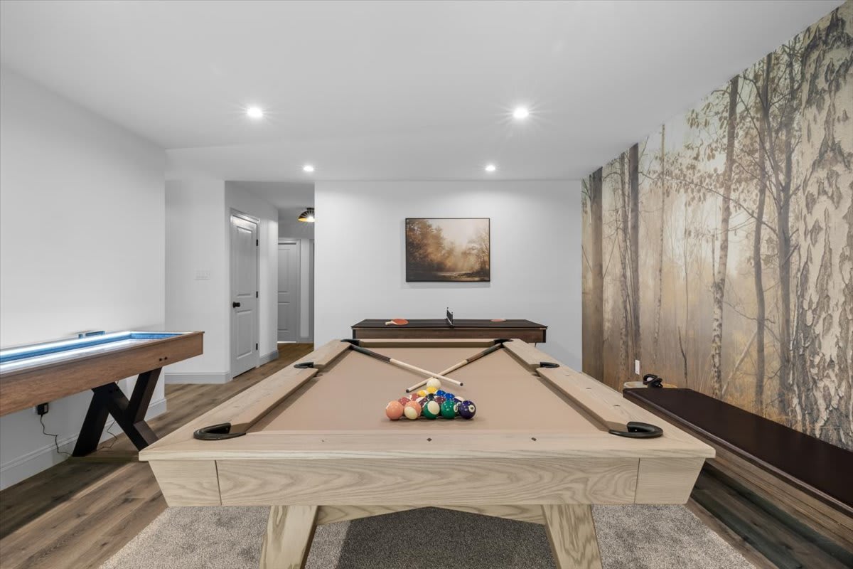 Rack up a game on the professional pool table in the wood-paneled game room.