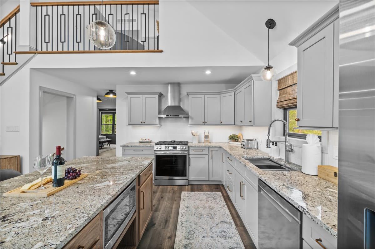 Granite countertops and modern fixtures make meal prep a breeze.