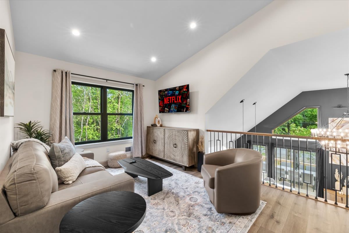 Wake up to breathtaking views through the expansive windows in this sun-filled bedroom retreat.