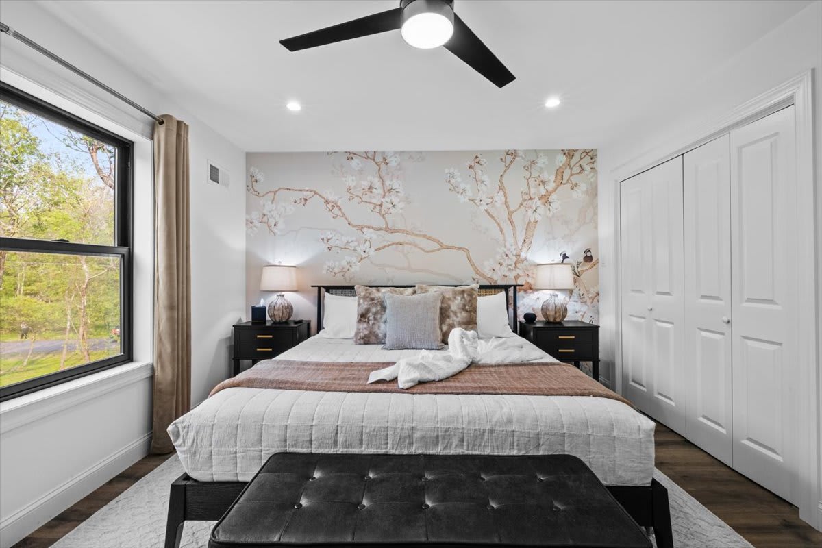 Ample closet space and serene decor make packing up easy in this bedroom.