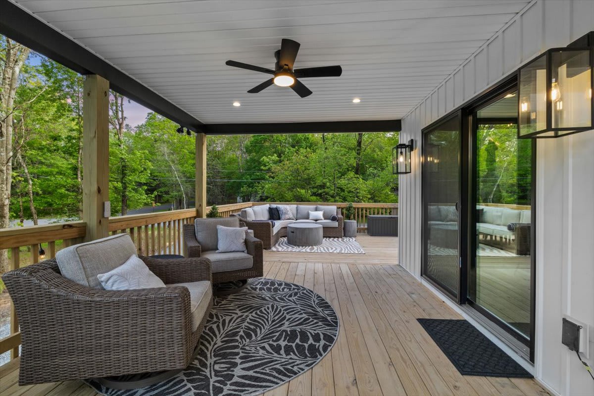 Step outside from the bedroom to a cozy seating spot on the covered deck.