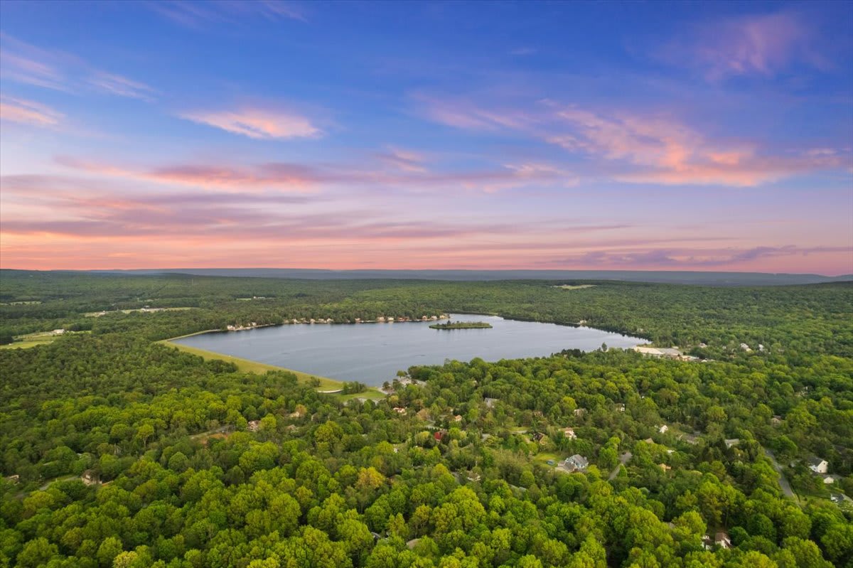 Golden sunsets paint the sky over the nearby lake for unforgettable evening views.