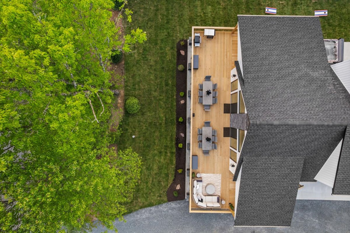The sprawling deck extends your living space into the serene Poconos landscape.