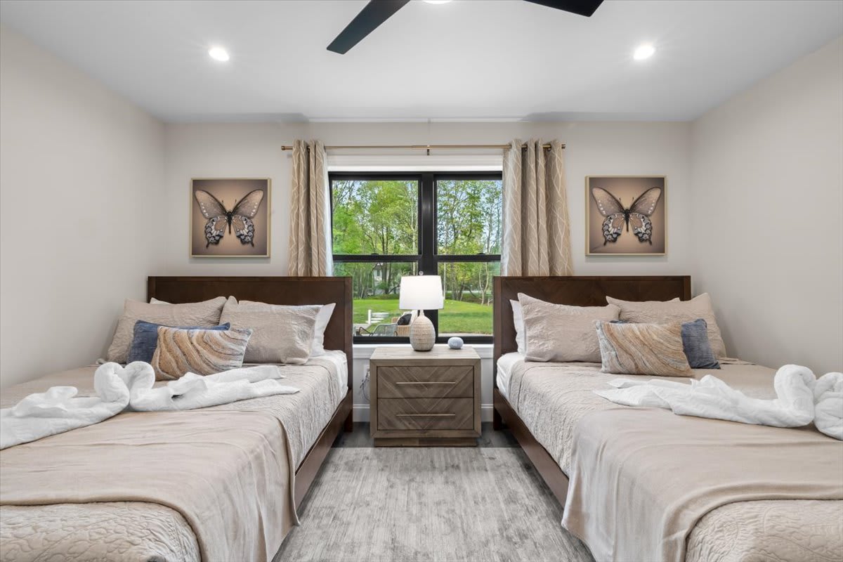 Butterfly art and soft linens welcome you to a peaceful night's sleep.