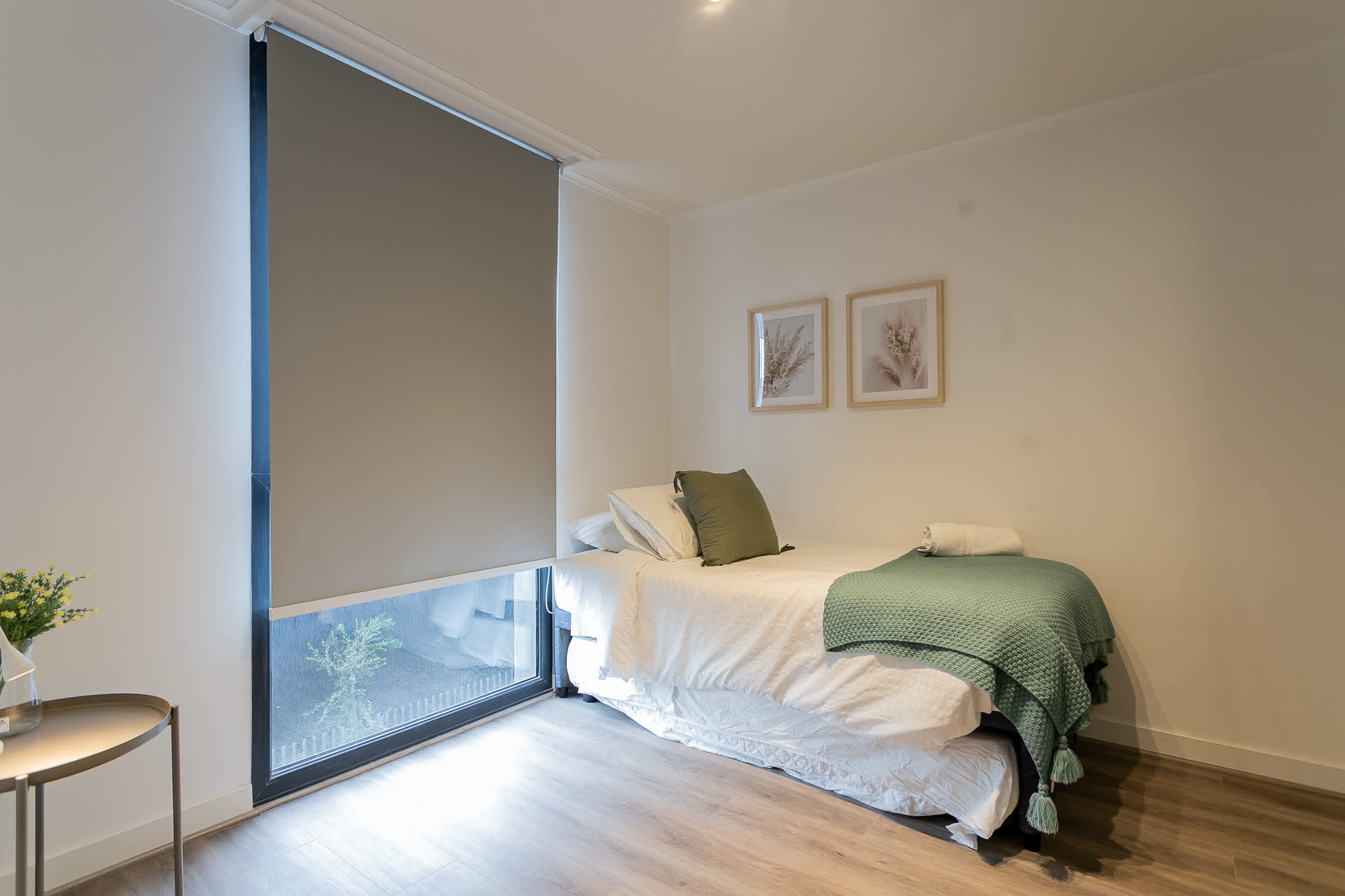 Cozy bedroom retreat with modern decor and a serene view, perfect for a restful stay.