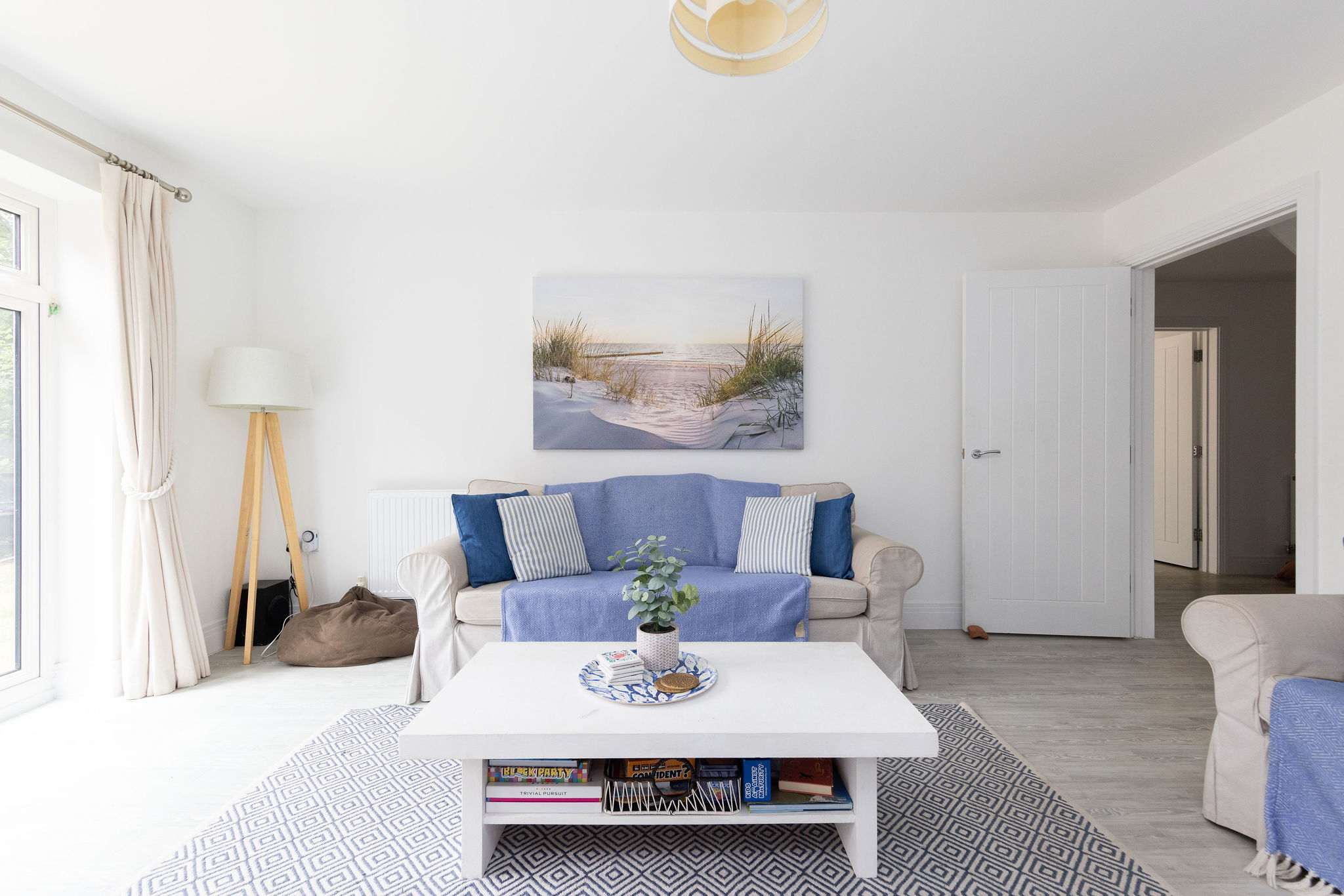 The stylish living area, designed for family comfort. With a Smart TV and a collection of board games, it's the perfect space to unwind together in the evenings.