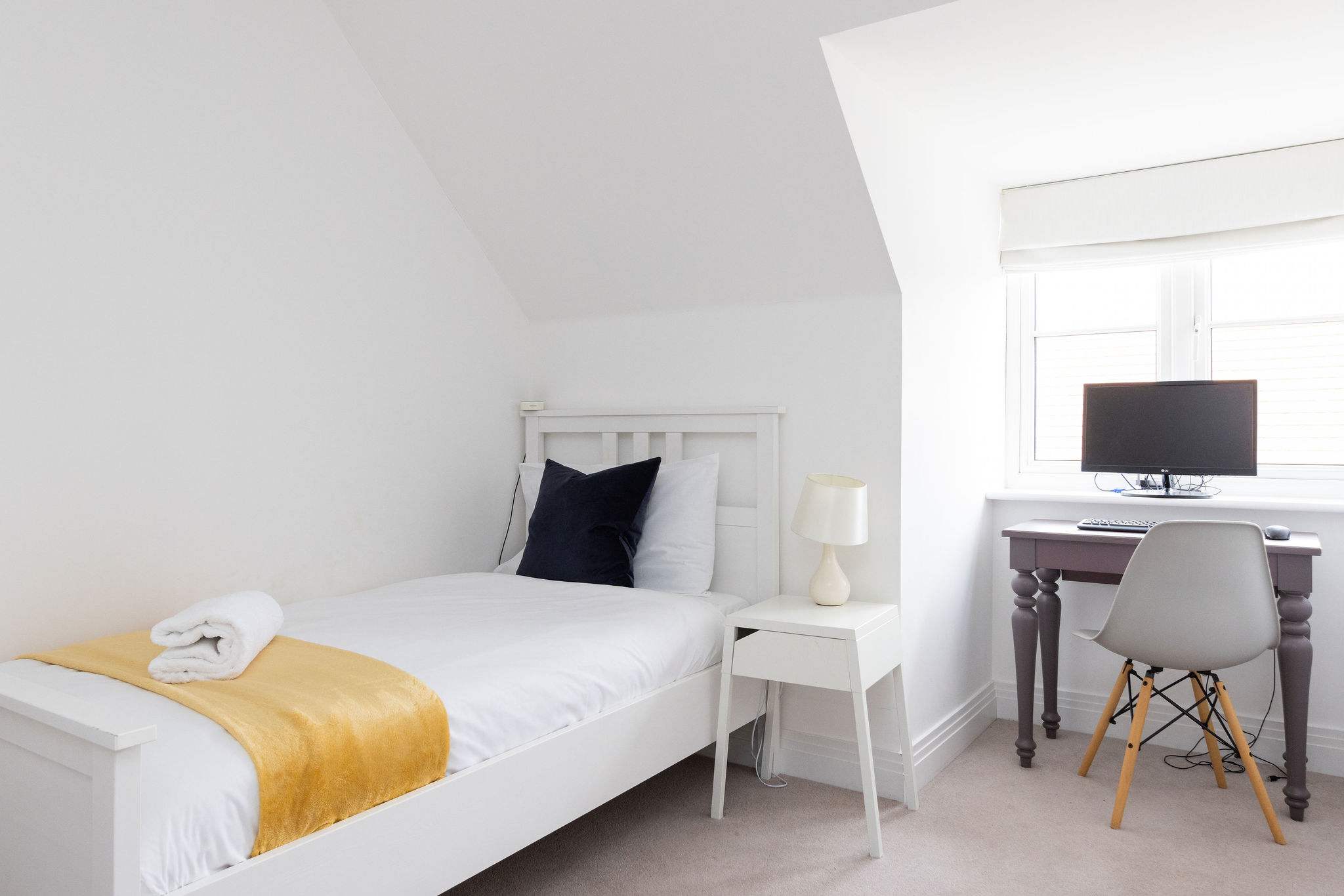 This room has a dedicated workspace for office work or study.