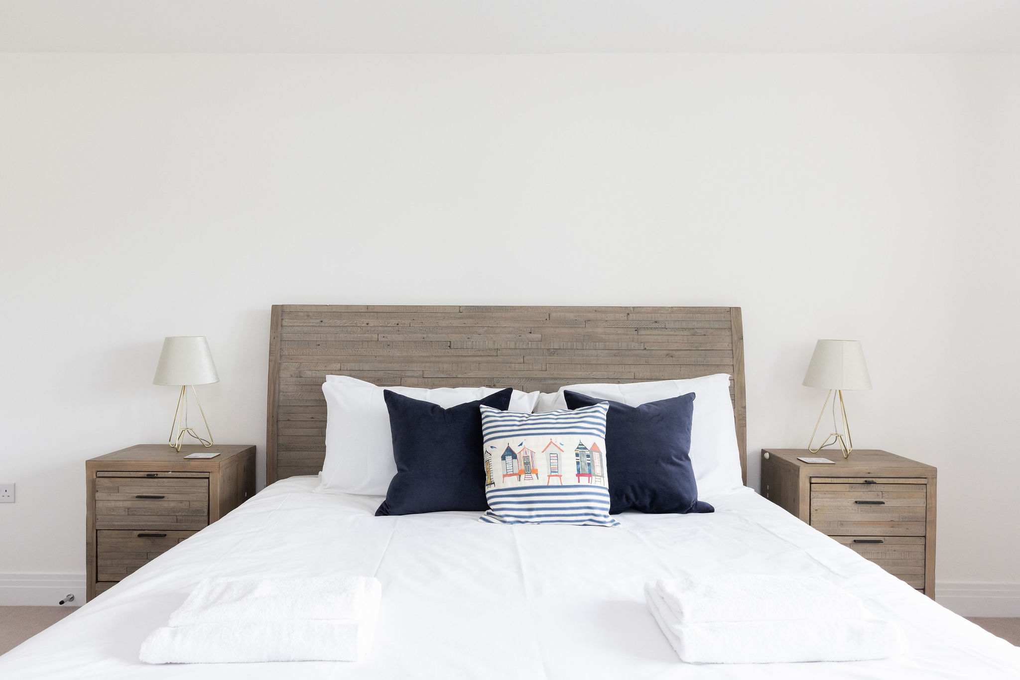 Sink into the comfortable king-size bed, complete with fresh linens and charming coastal details, for a perfect night's sleep.