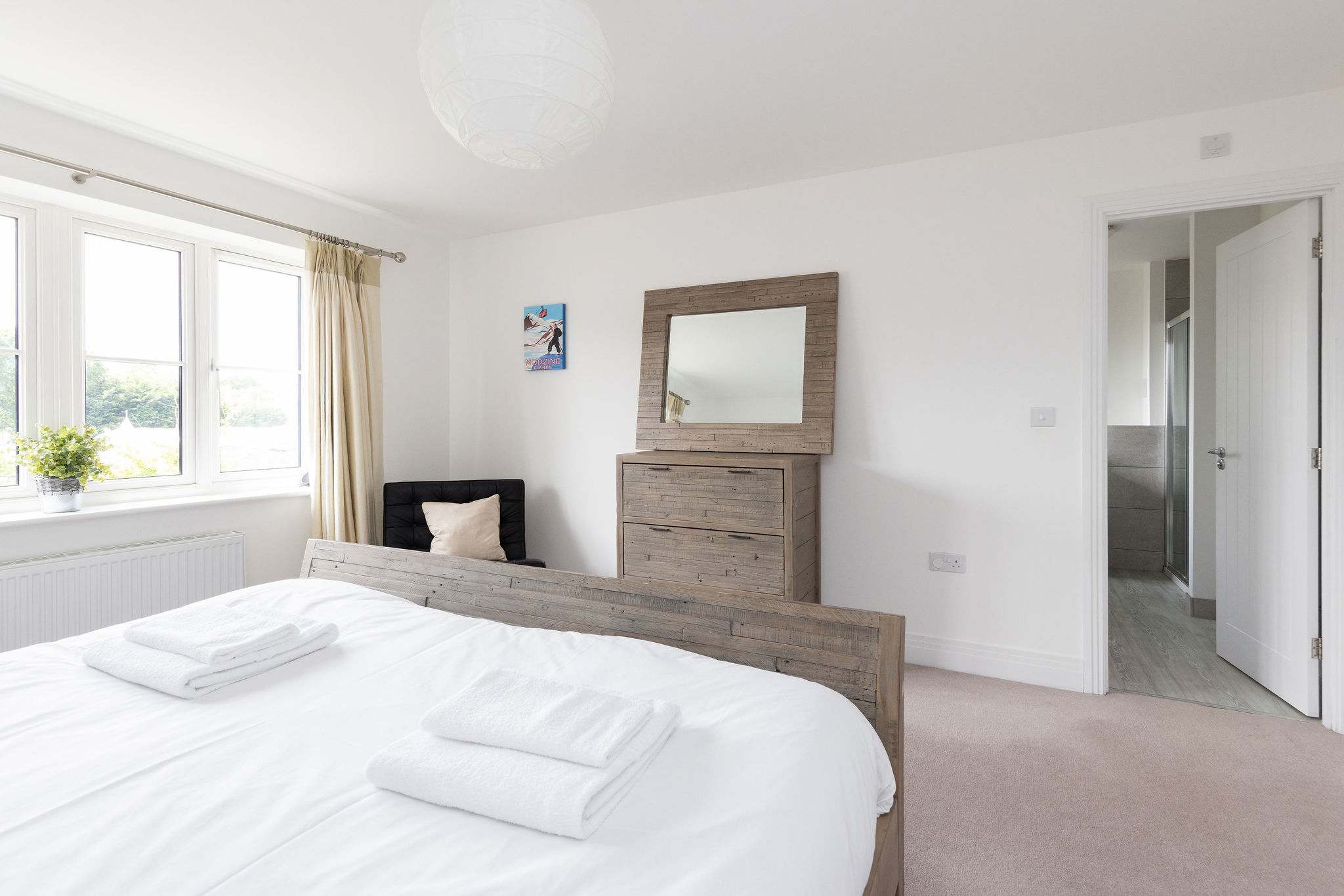 This bright and spacious room includes ample storage and the convenience of a private en-suite bathroom, just steps away.