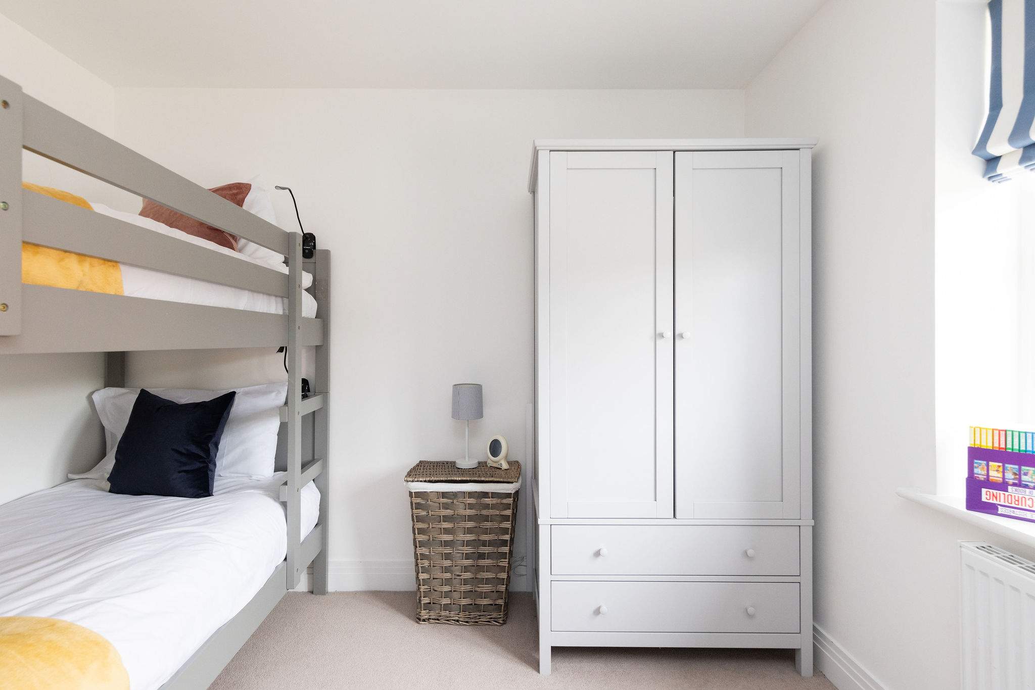 This bedroom has a full-size wardrobe.