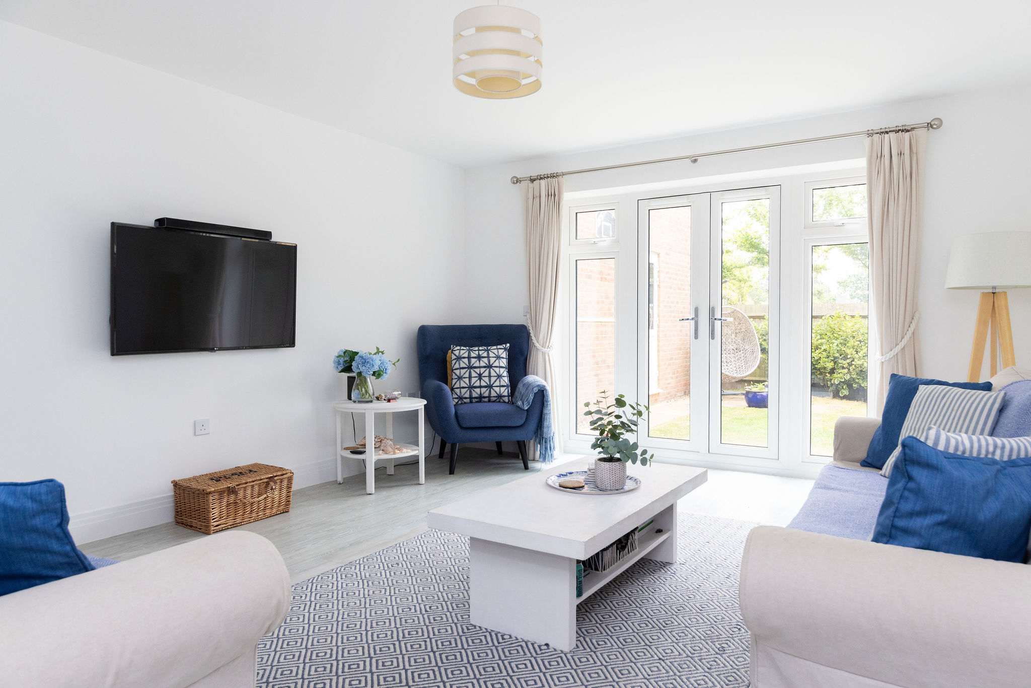 The main living area, where you can kick back and relax. With a Smart TV and direct access to the garden, it’s designed for easy holiday living.