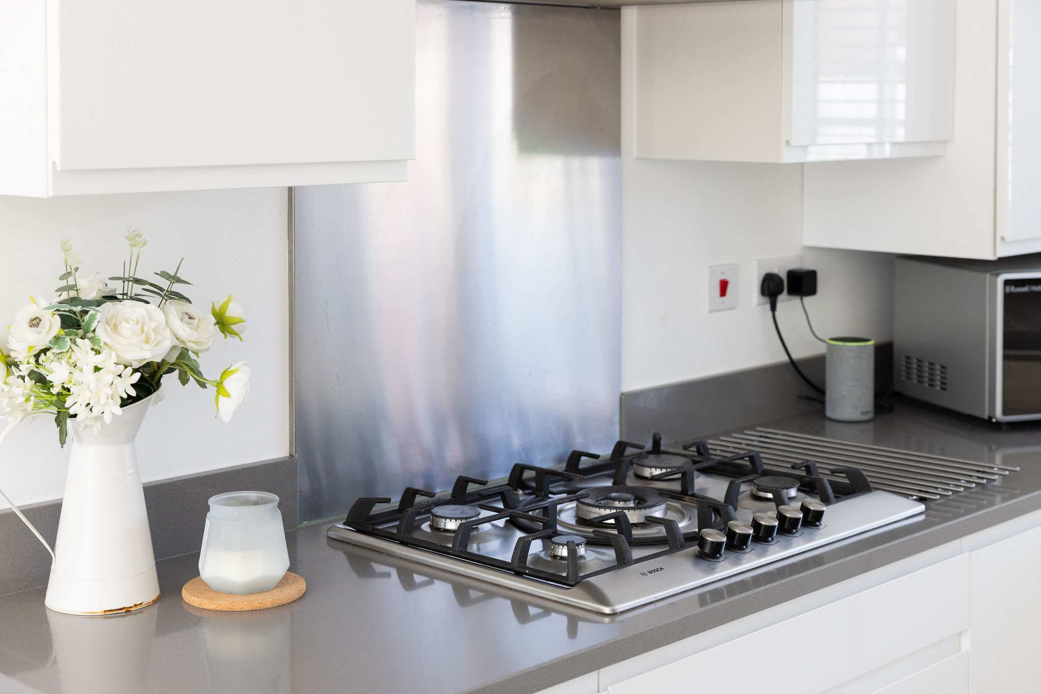 Cook your favourite meals in this sleek and modern kitchen.