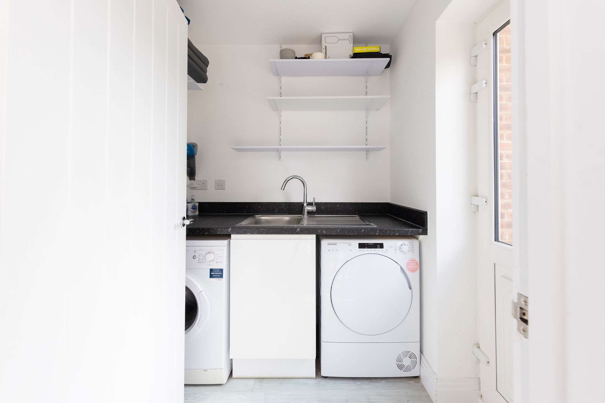 Enjoy the convenience of in-house laundry facilities, featuring a washer, dryer and sink, for a hassle-free stay.