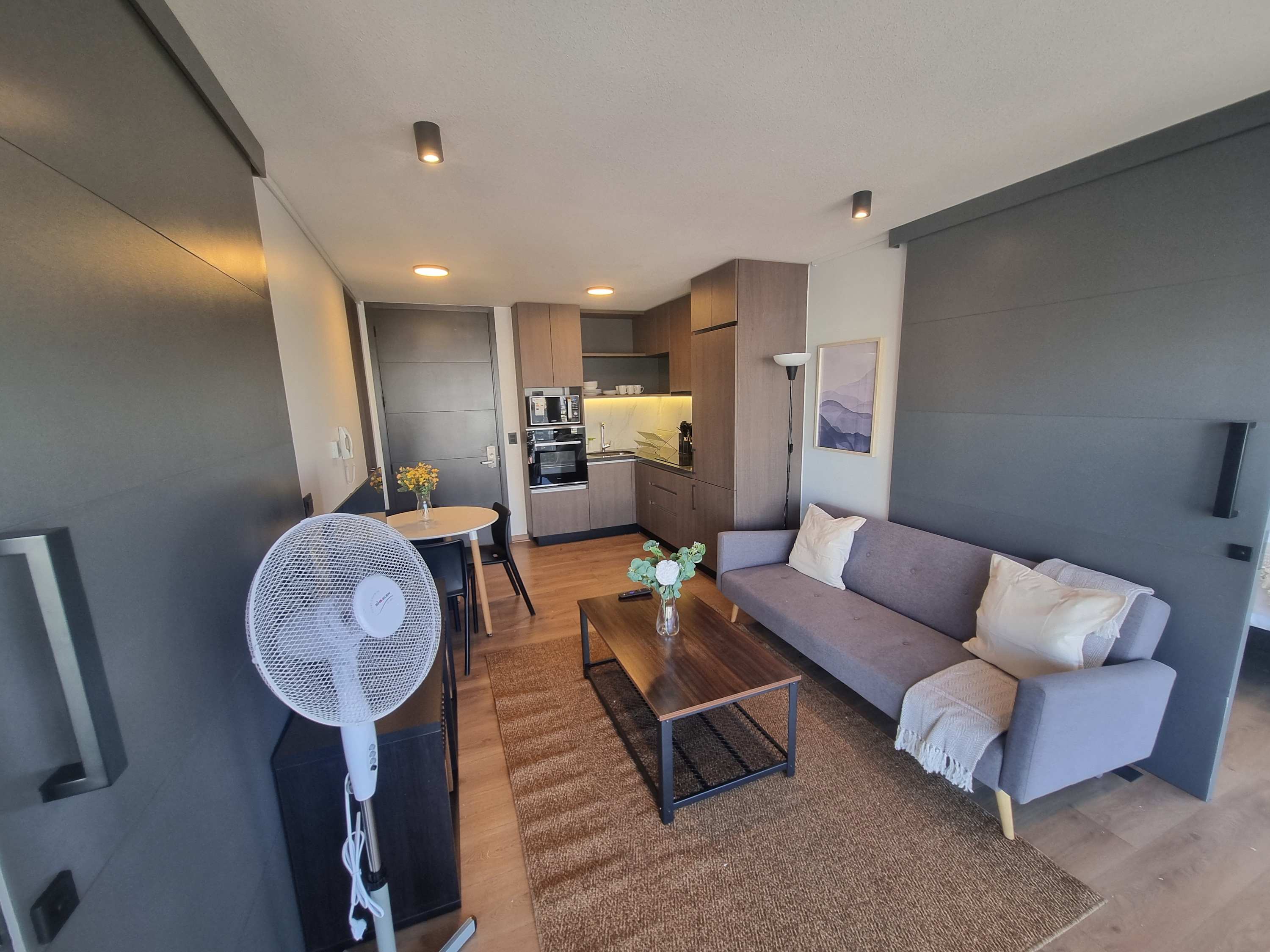 Experience comfort in this stylish living area with modern amenities and a cozy atmosphere, perfect for relaxation.