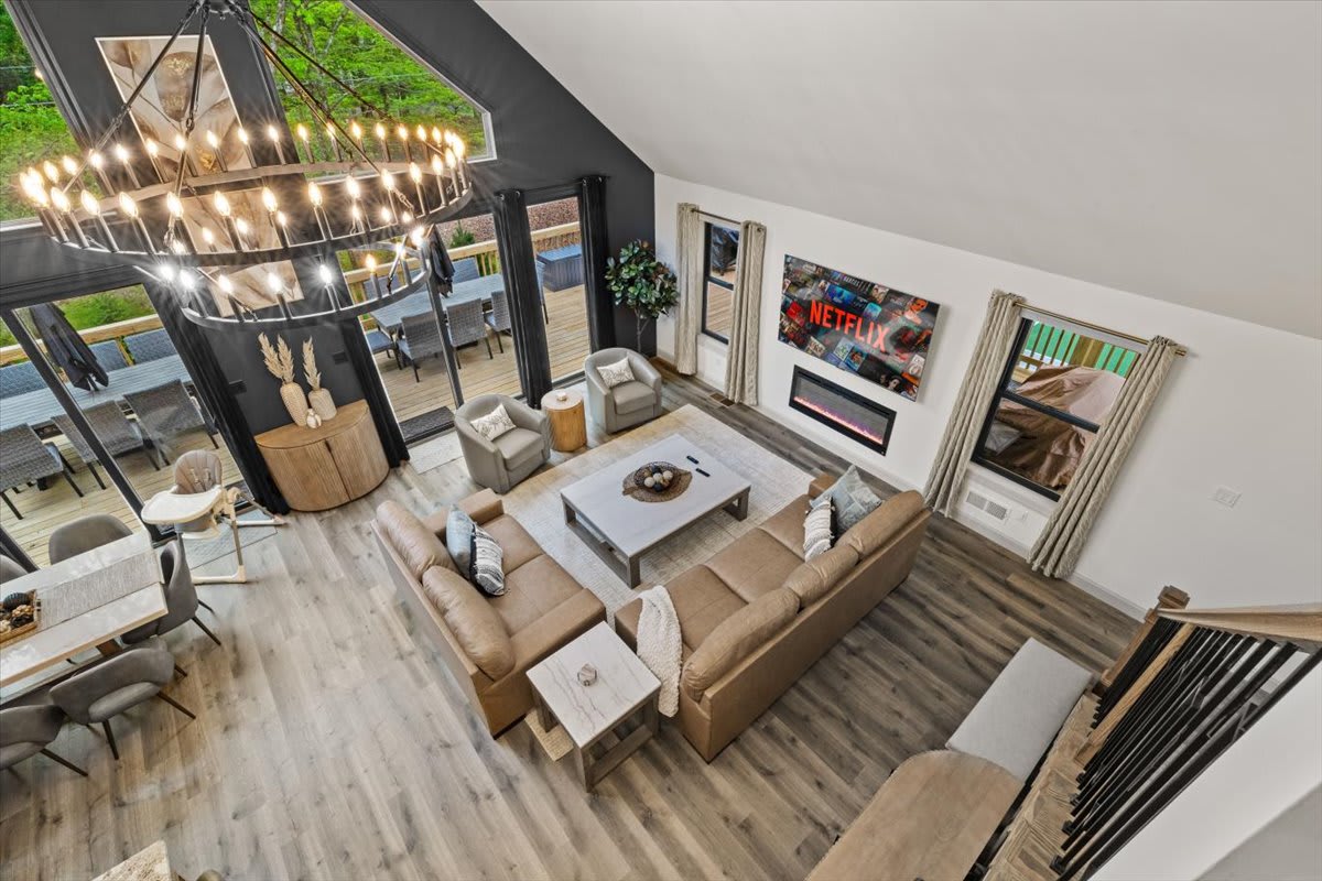 The living room features an electric fireplace and smart TV for cozy movie nights.