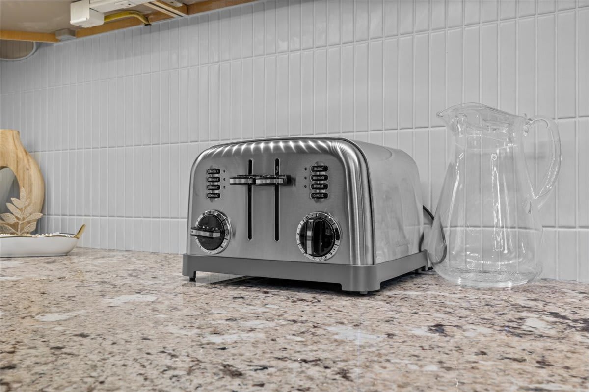 Start your morning right with the modern toaster and fully equipped kitchen amenities.