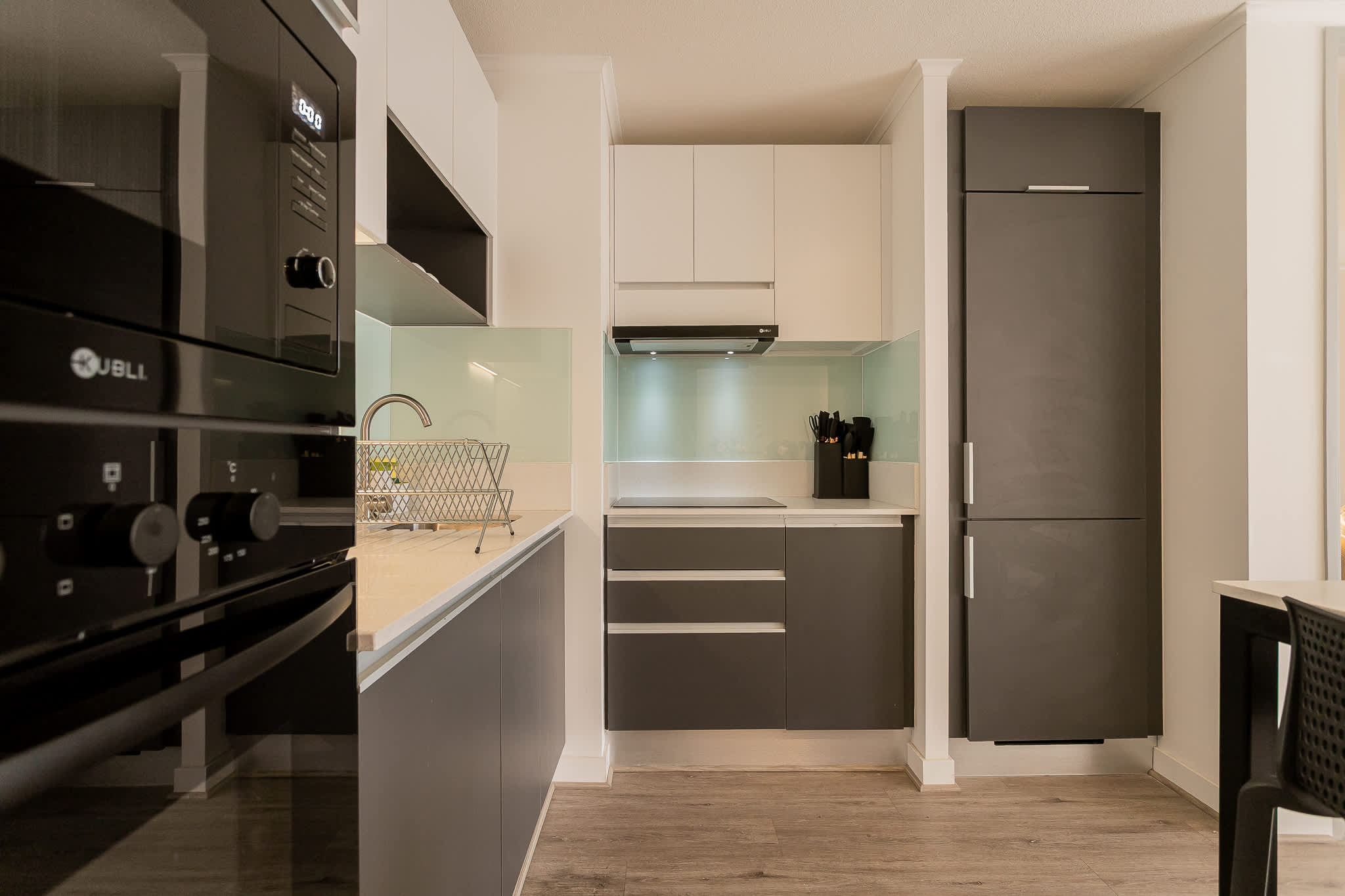 Sleek, modern kitchen with top-notch appliances and stylish design, perfect for culinary adventures.