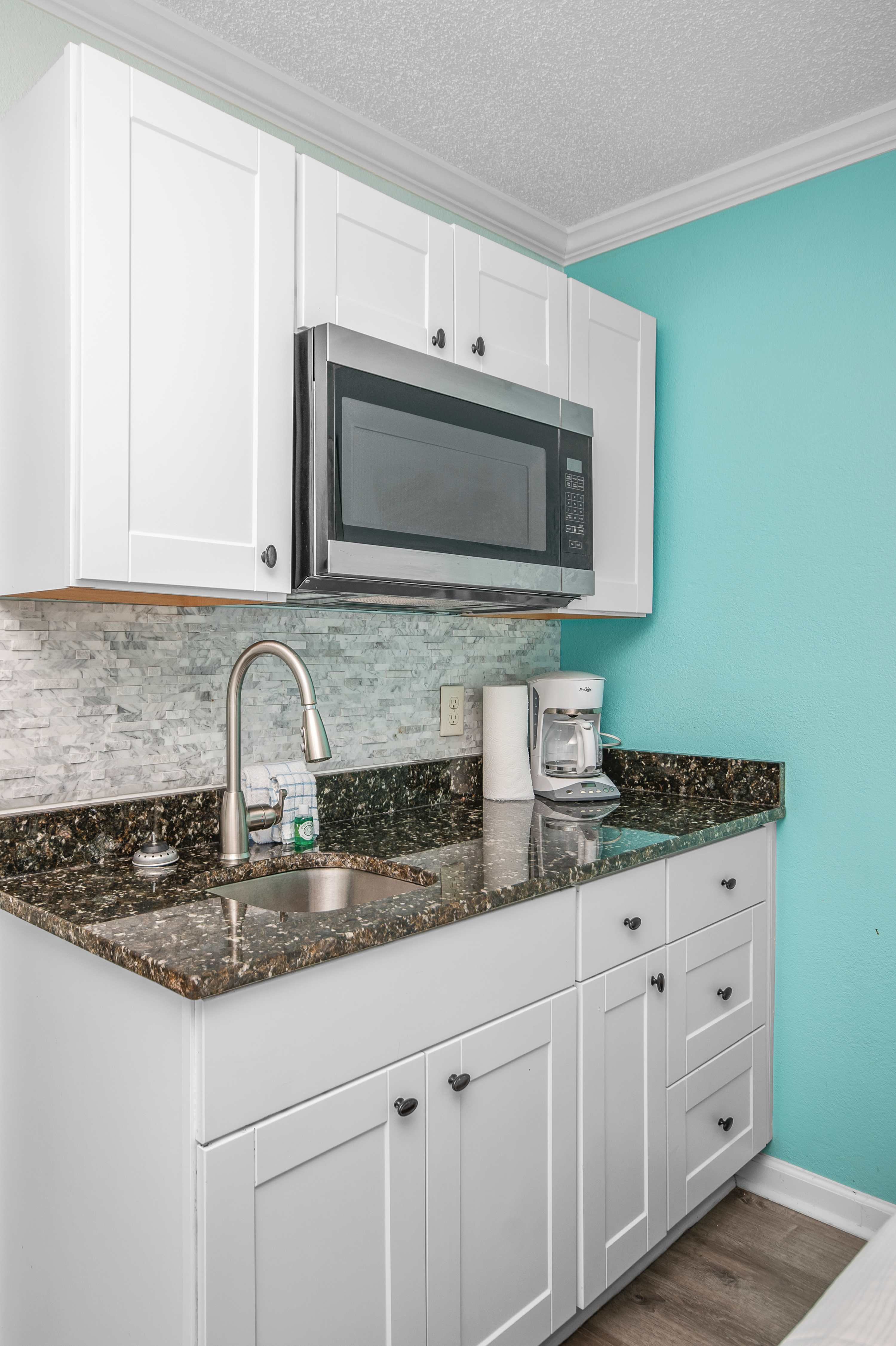 Fully stocked kitchen with everything you need for home-cooked meals by the beach.
