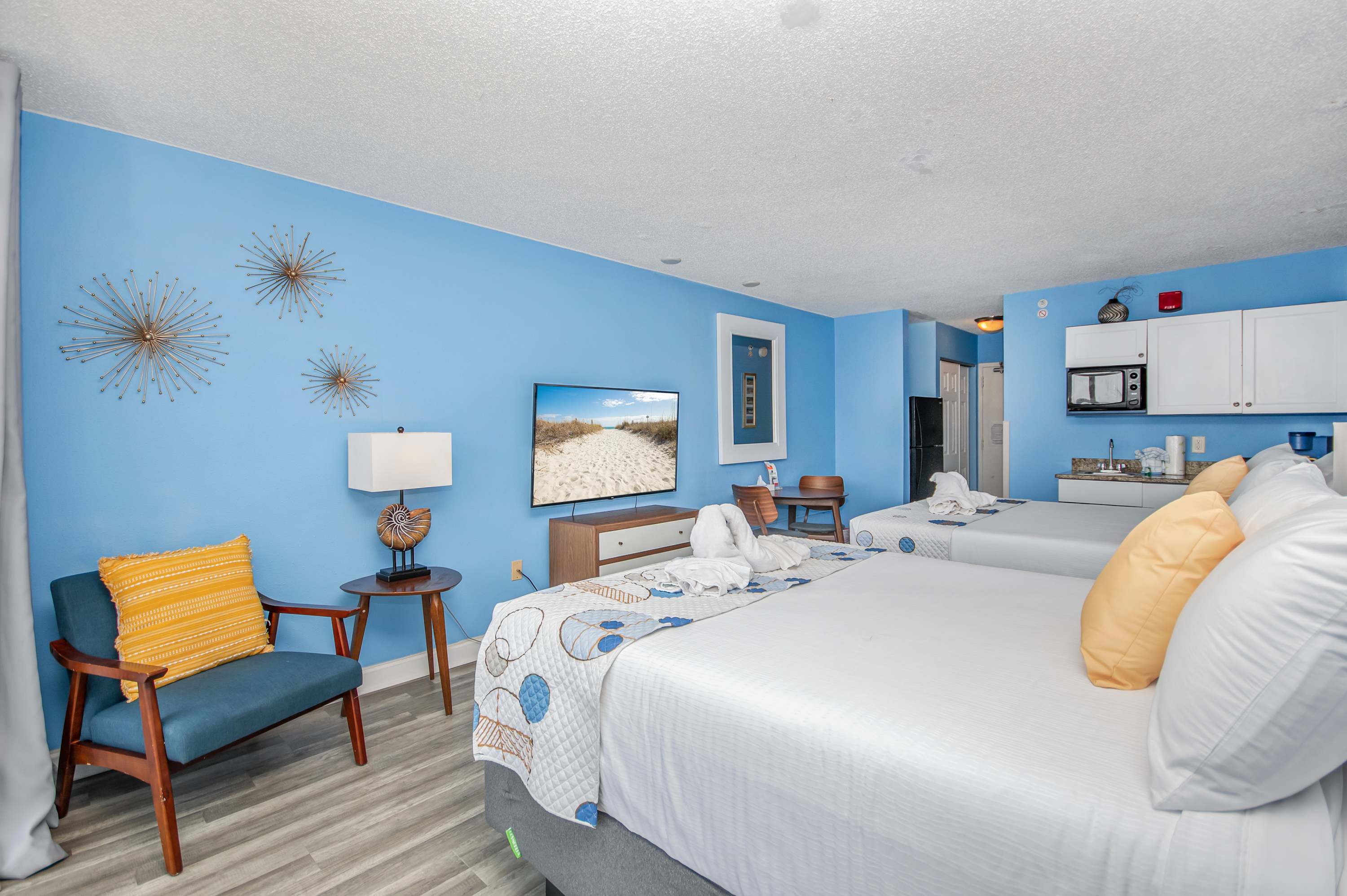 Feel at home with convenient nightstands, charging stations, and cozy comforters.
